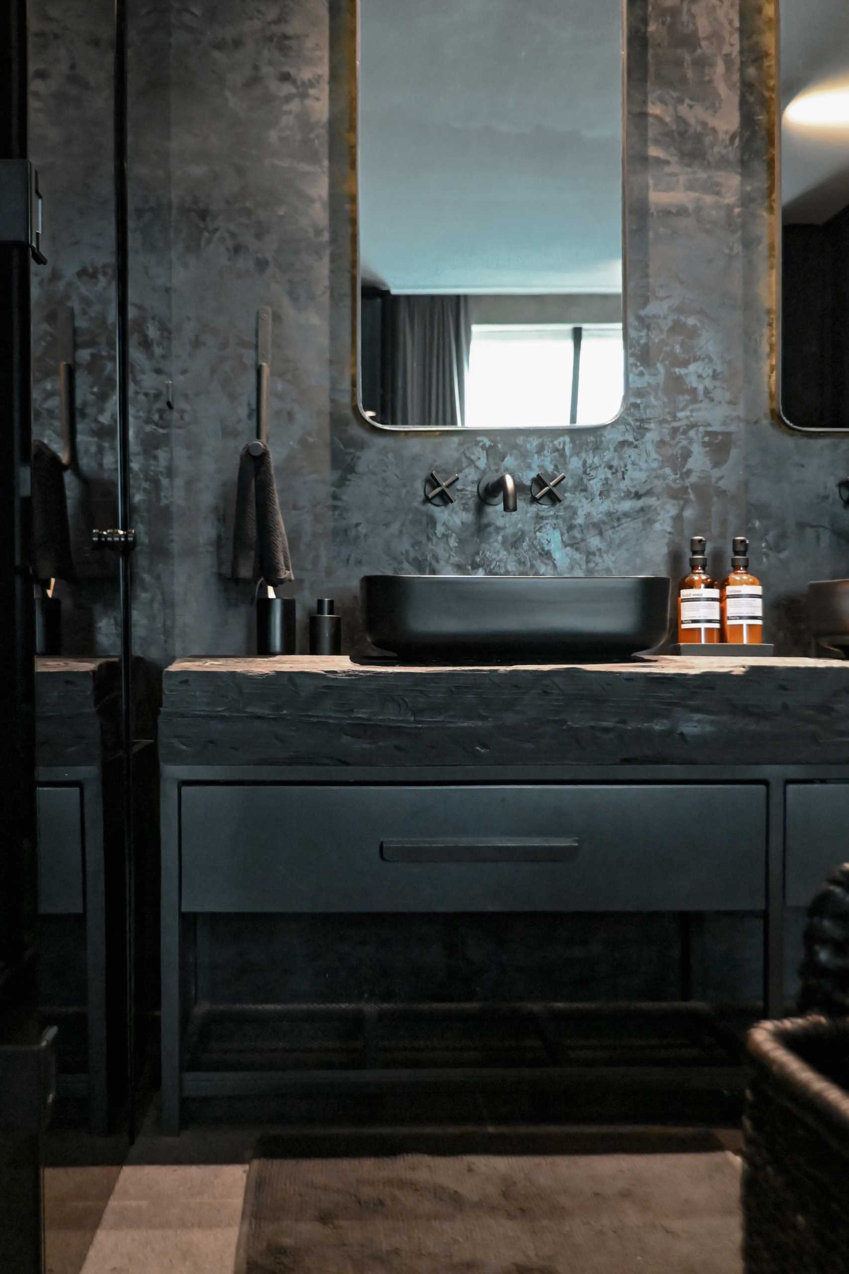 A modern black bathroom.