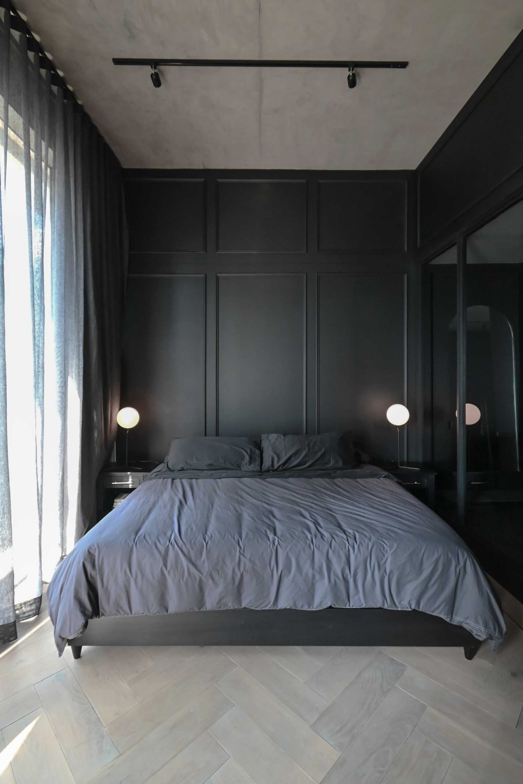 A modern black bedroom.