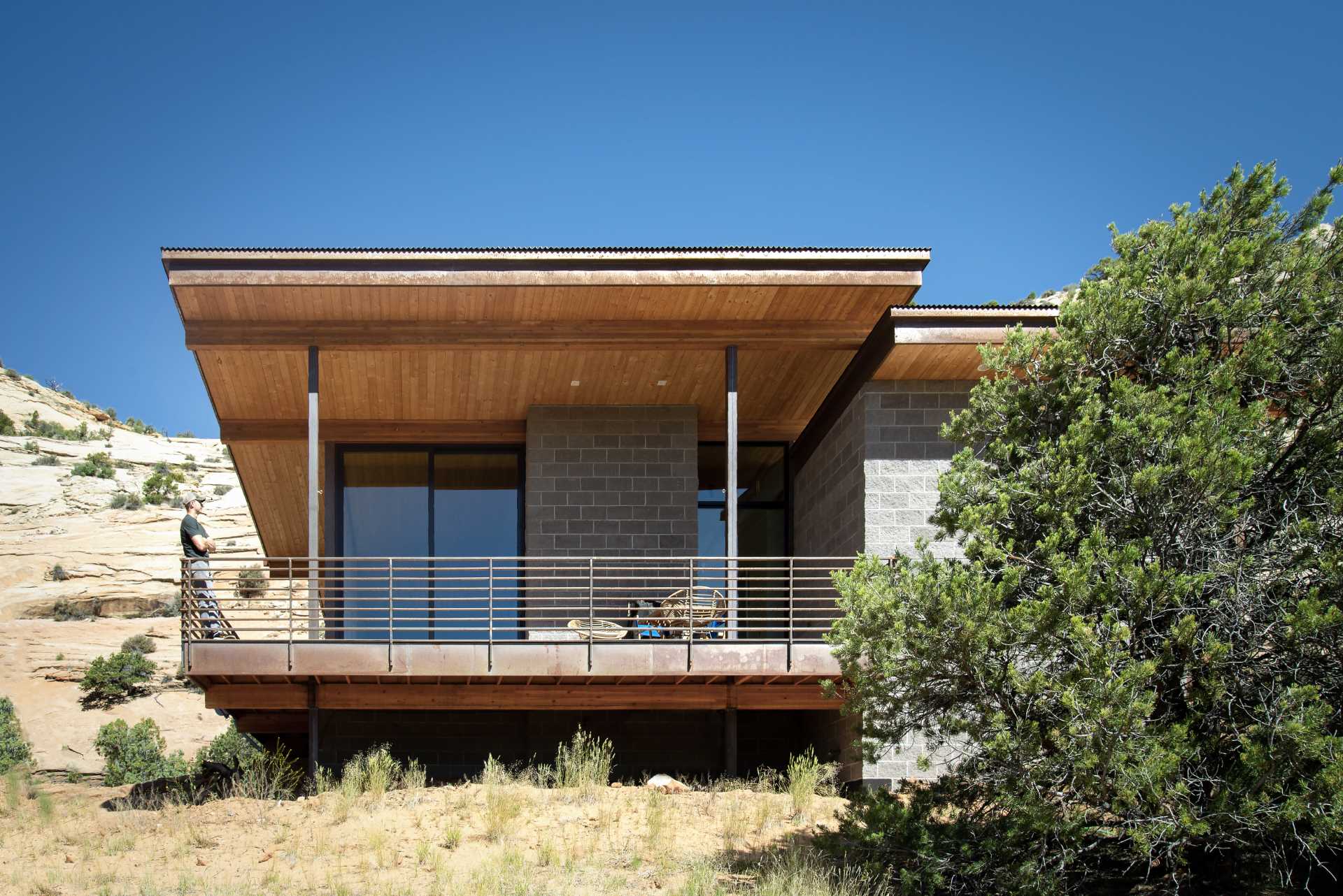 A modern desert home that features weathering steel, split-face concrete block, and cedar.