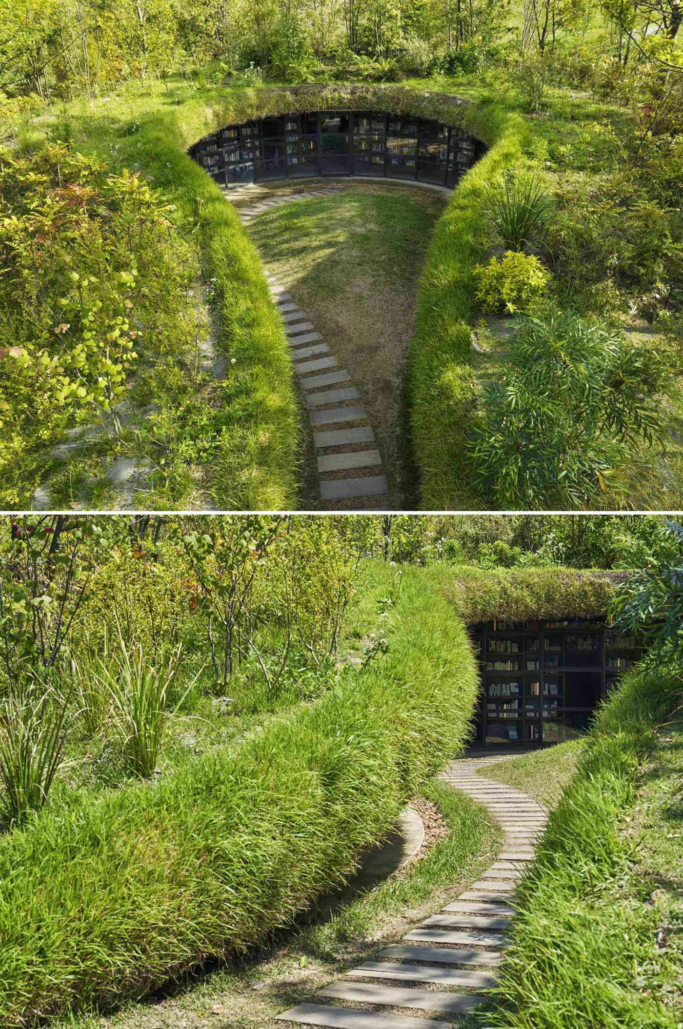 A modern library built into the earth includes a curved glass wall and bookshelves that wrap around the wall.