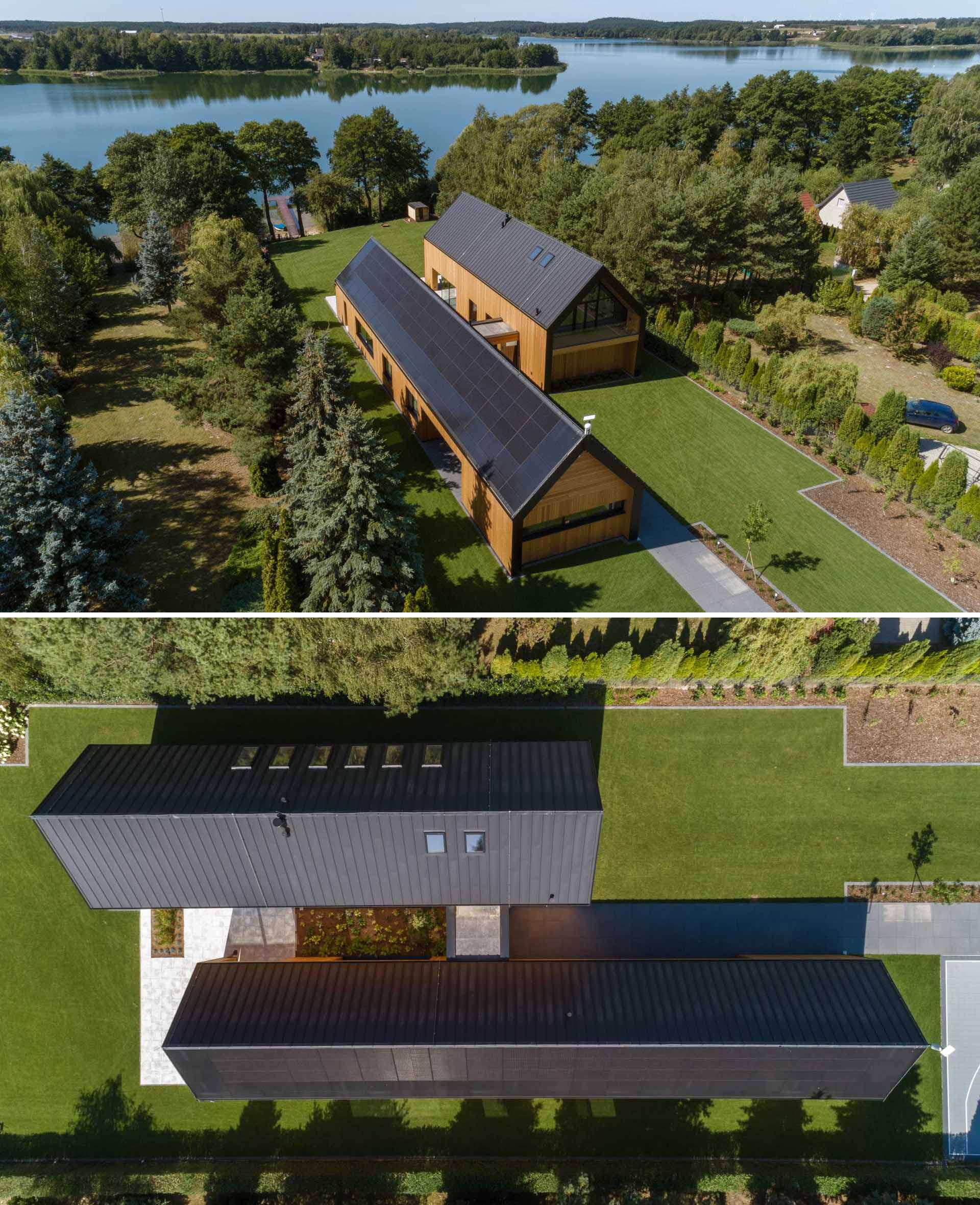 A modern house that has a layout similar to two barns positioned side-by-side.