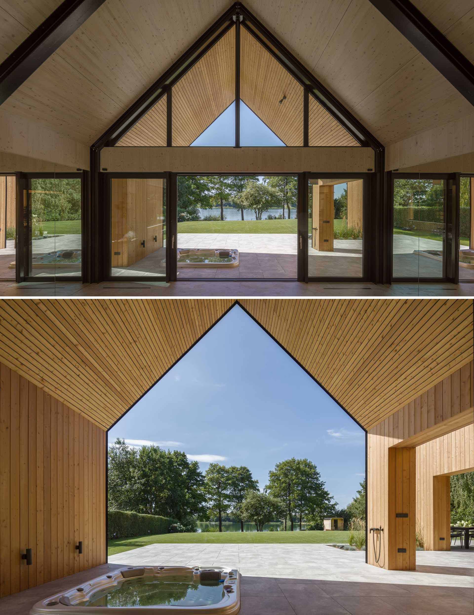 A modern house that has a layout similar to two barns positioned side-by-side.