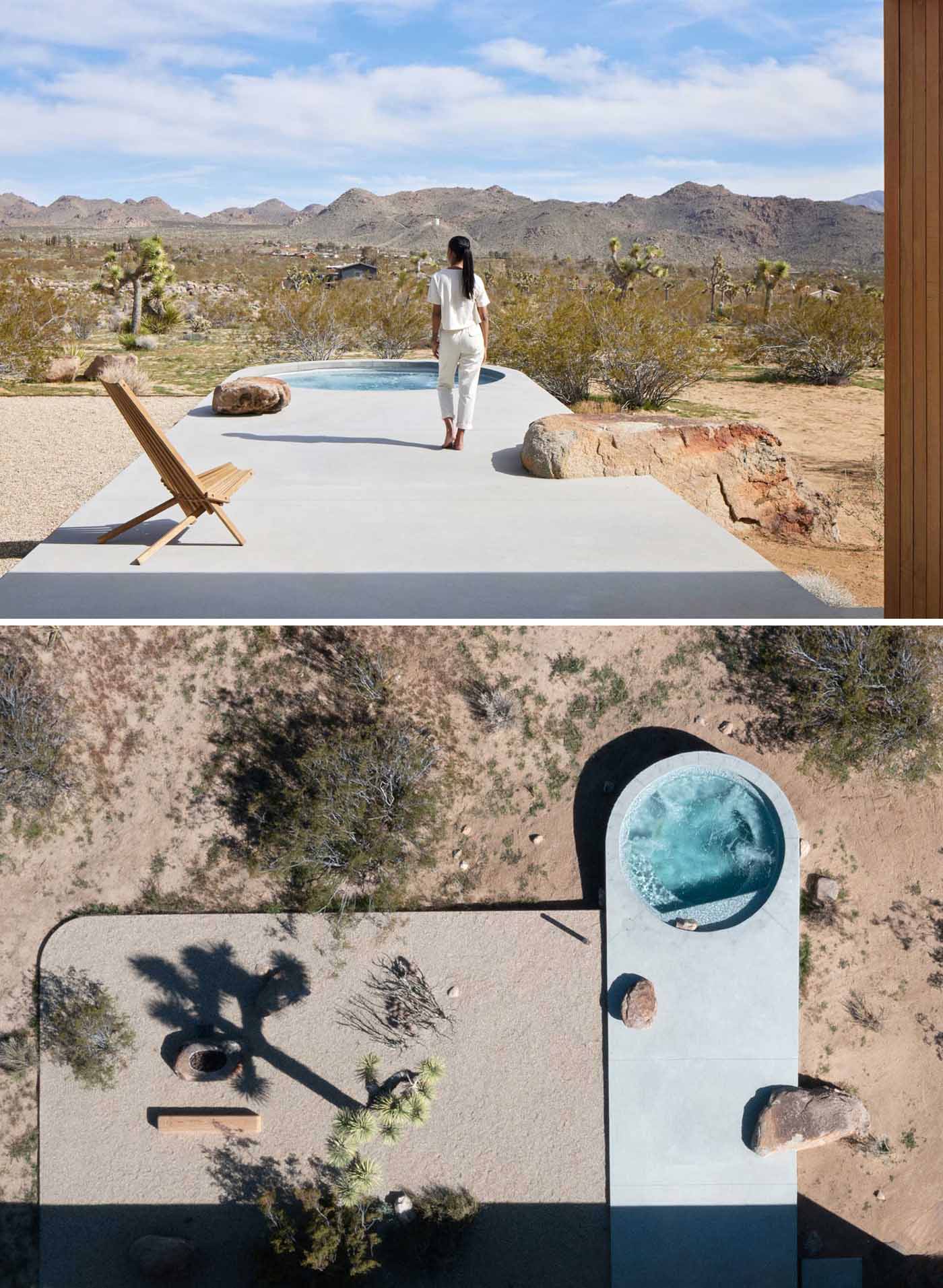 A concrete platform extends perpendicularly from the breezeway landing to the plunge pool, which has a monolithic and geometric form.