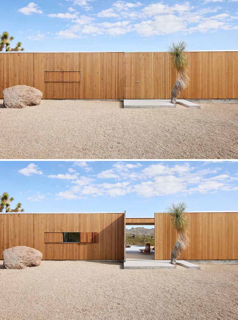 A desert home with wood siding that blends into its surrounding.