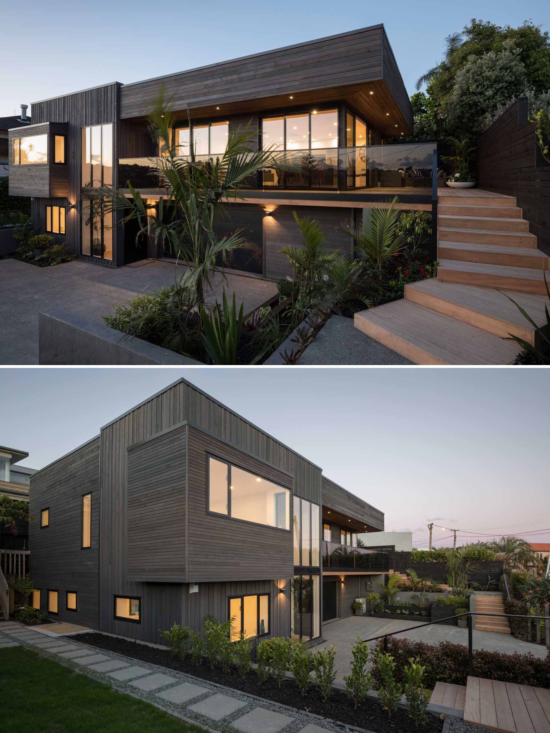 A renovated 1980's plaster clad home in New Zealand, was given a contemporary dark wood exterior and new windows.