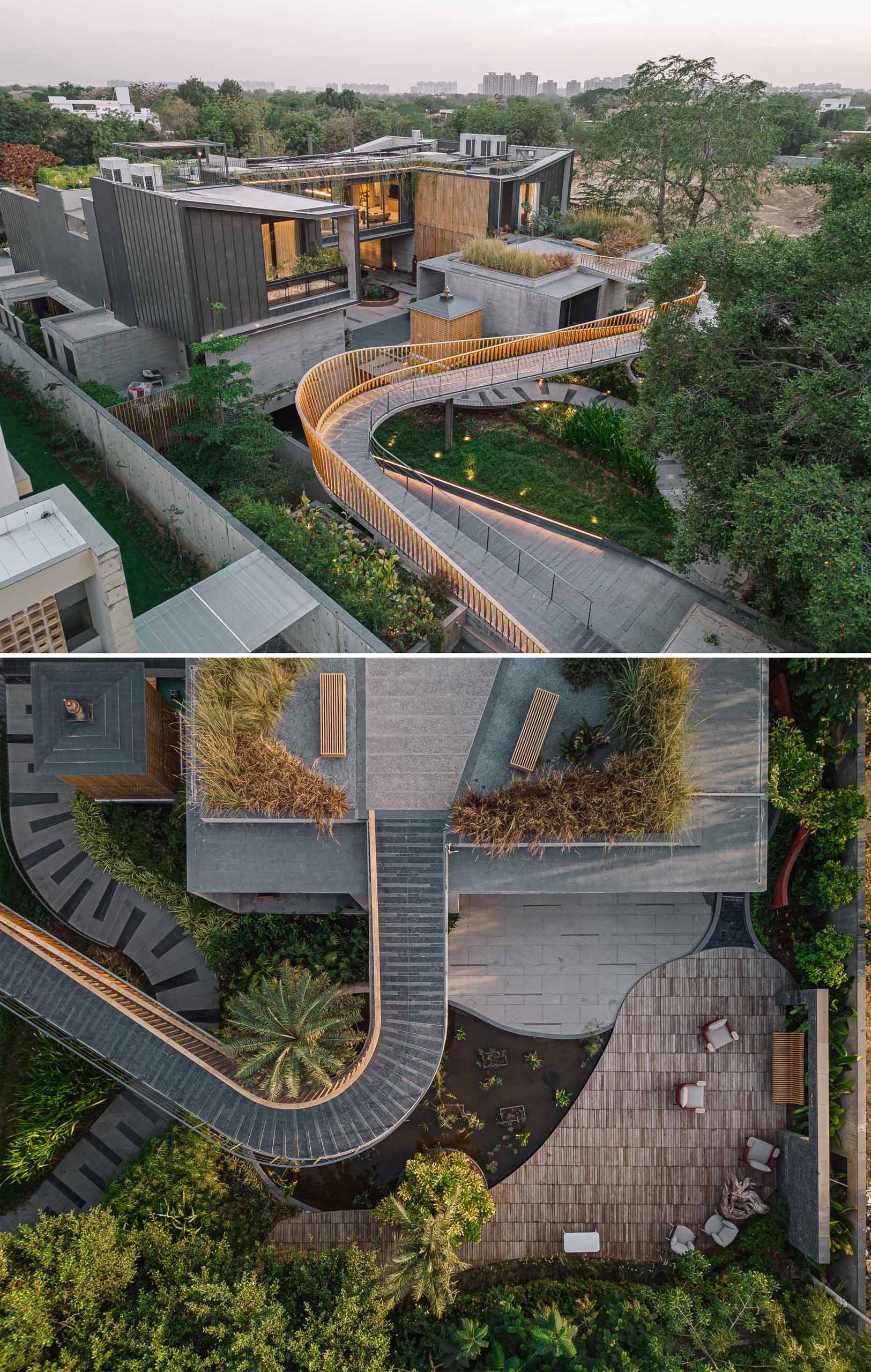 A curving bridge walkway leads to various outdoor entertaining areas of this modern home designed for multi-generational living.