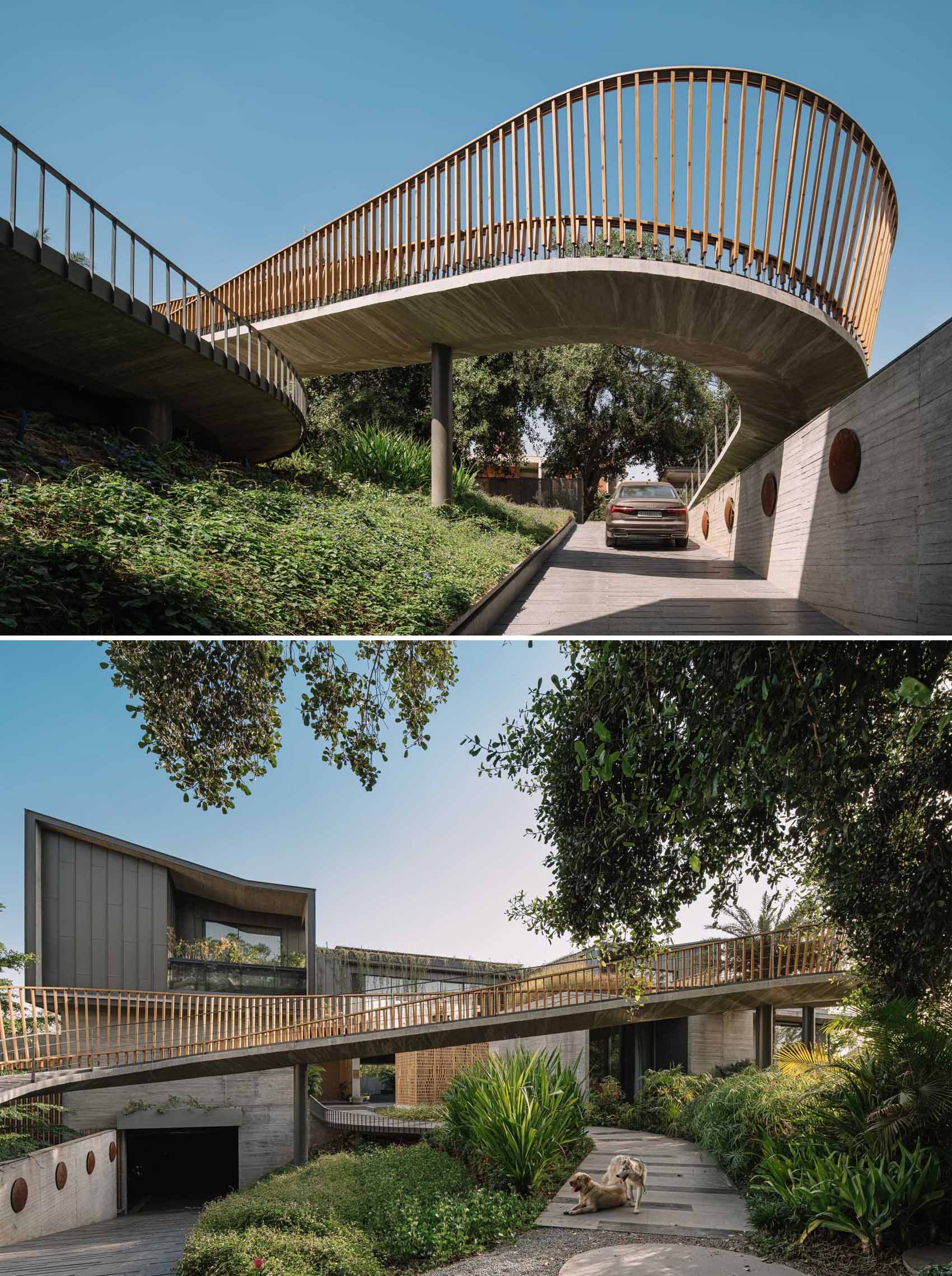 A curving bridge walkway leads to various outdoor entertaining areas of this modern home designed for multi-generational living.