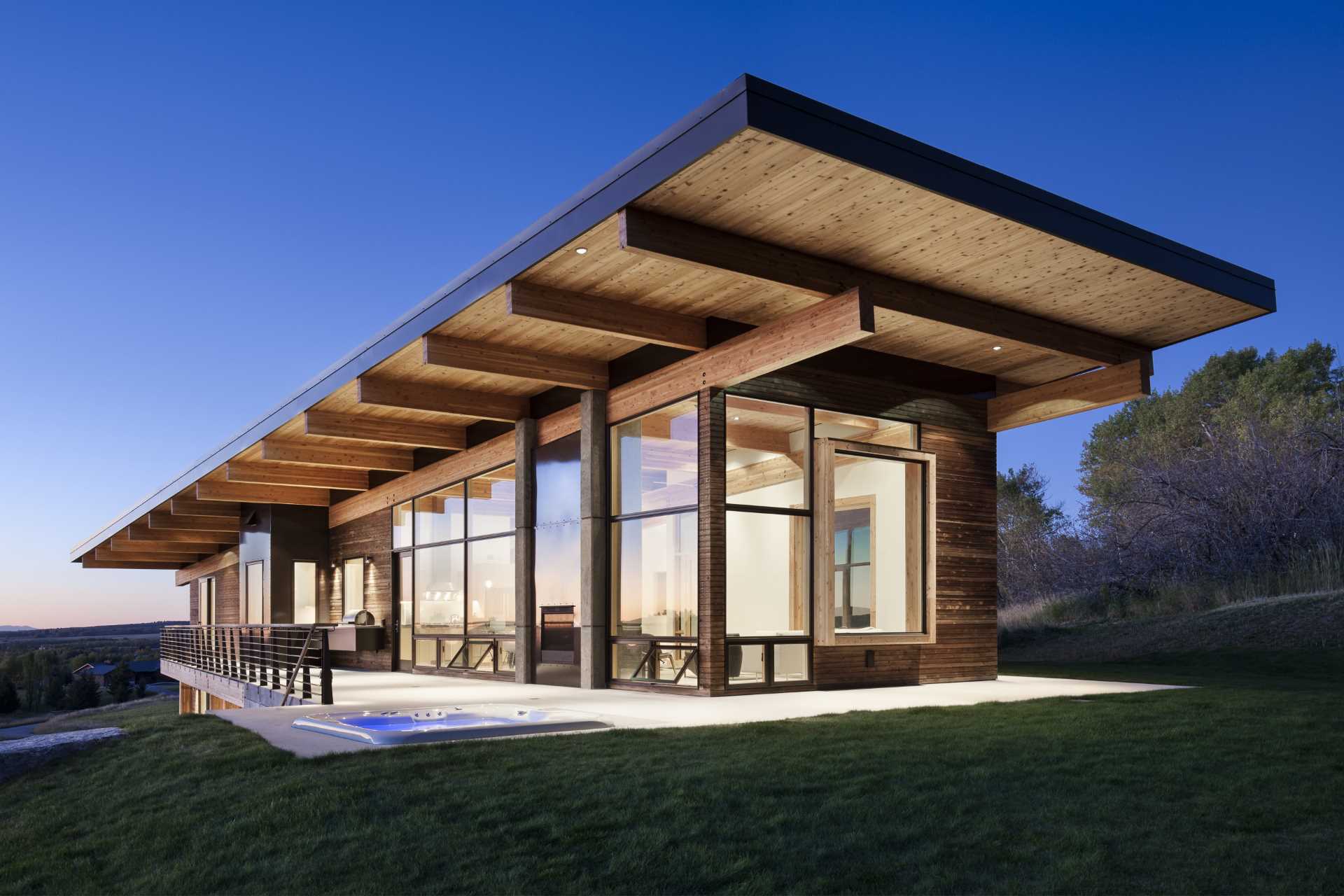 A modern post and beam house with wood siding.