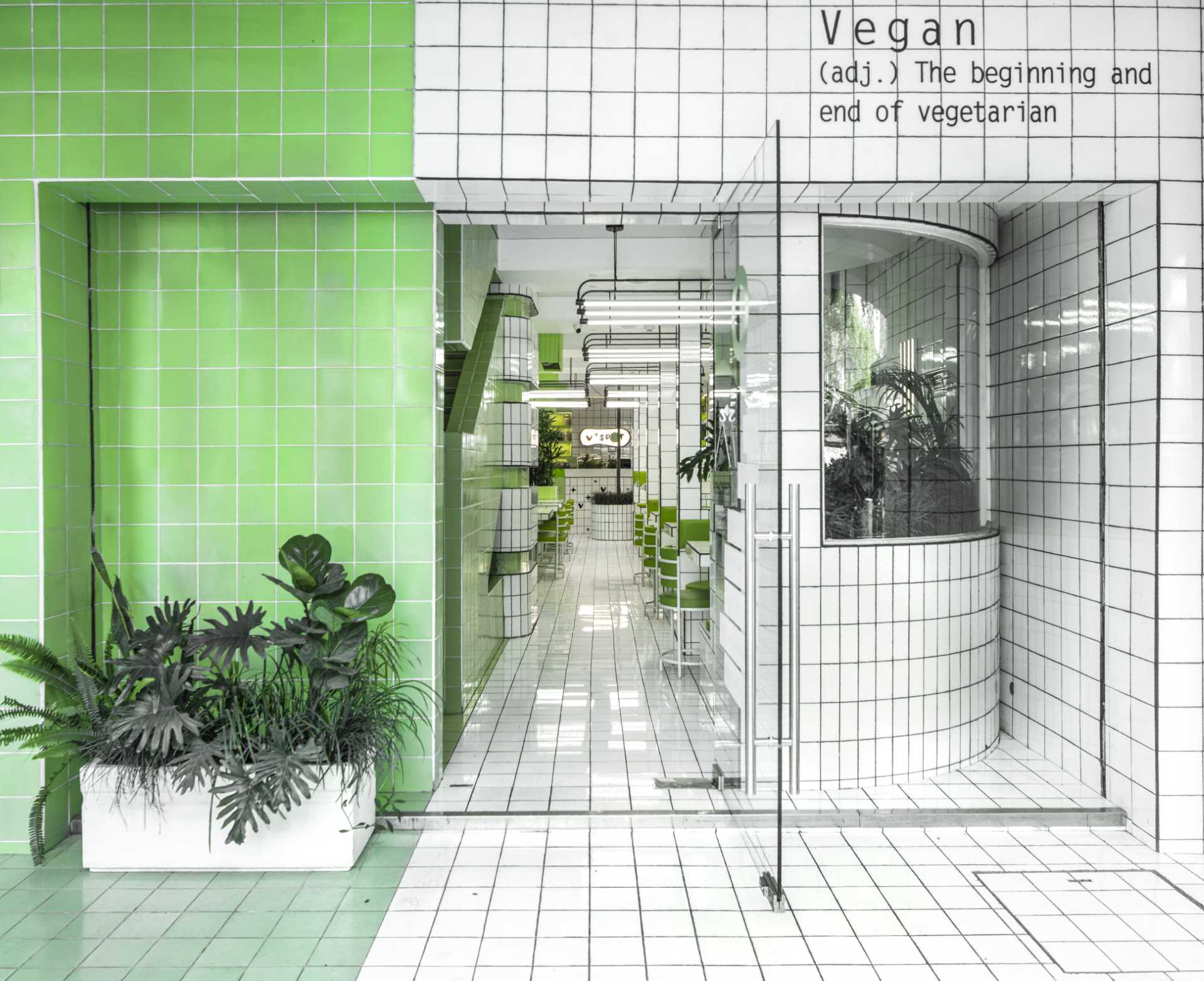 A modern green and white tiled cafe.