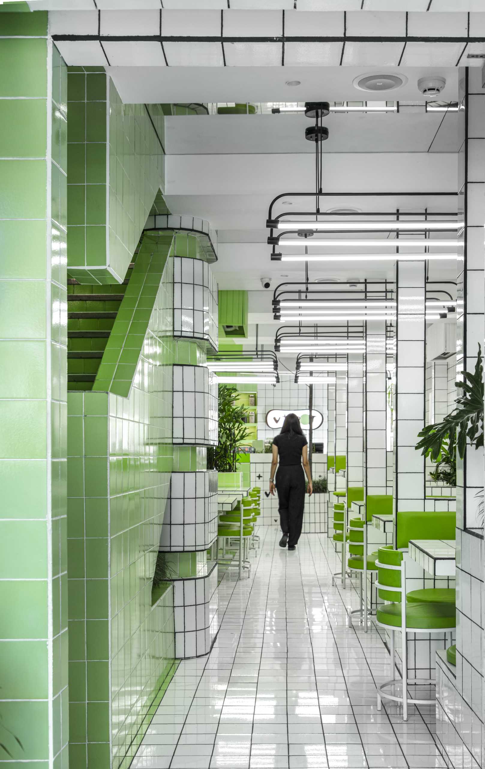 A modern green and white tiled cafe.