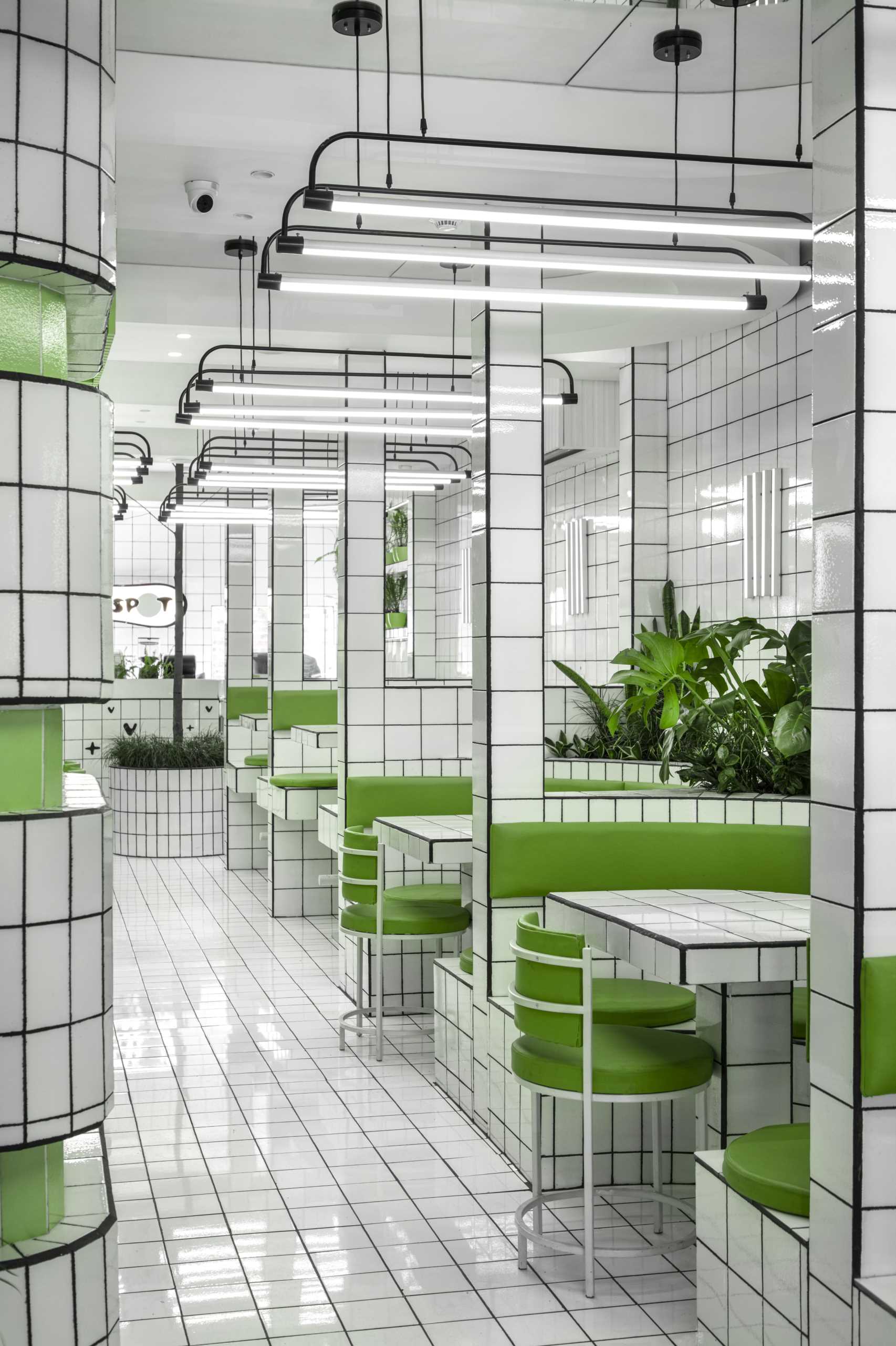 A modern green and white tiled cafe.