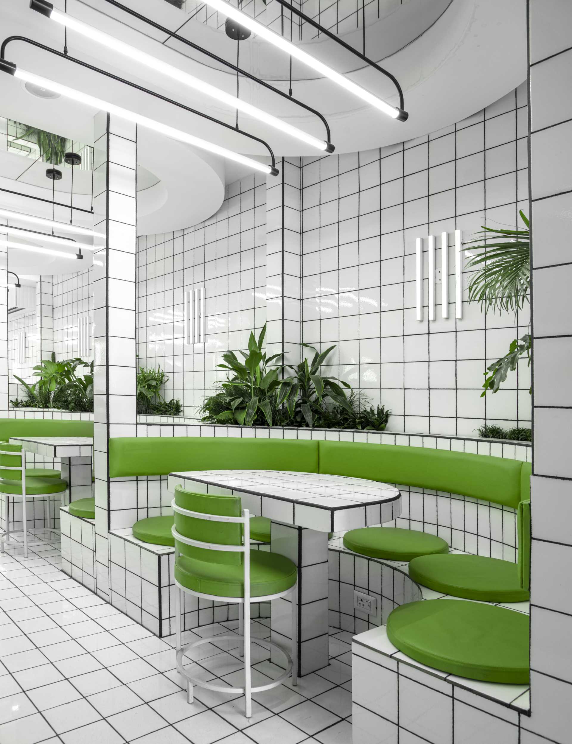 A modern green and white tiled cafe.