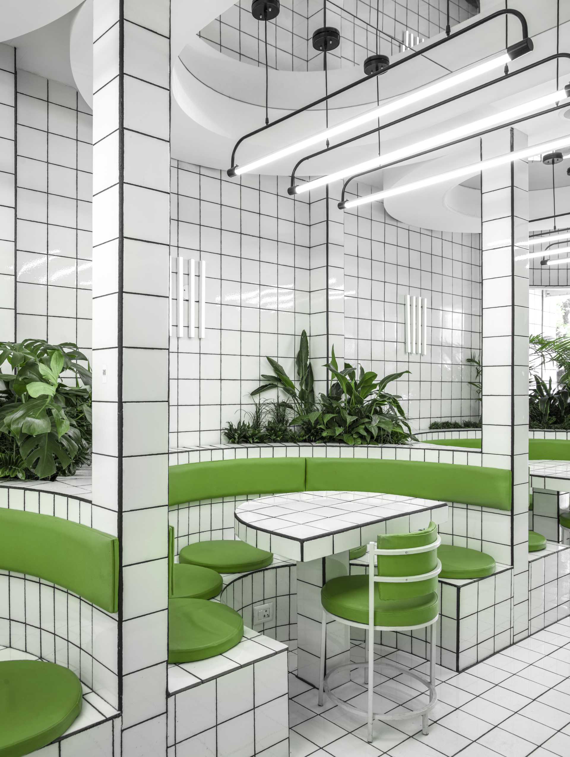 A modern green and white tiled cafe.