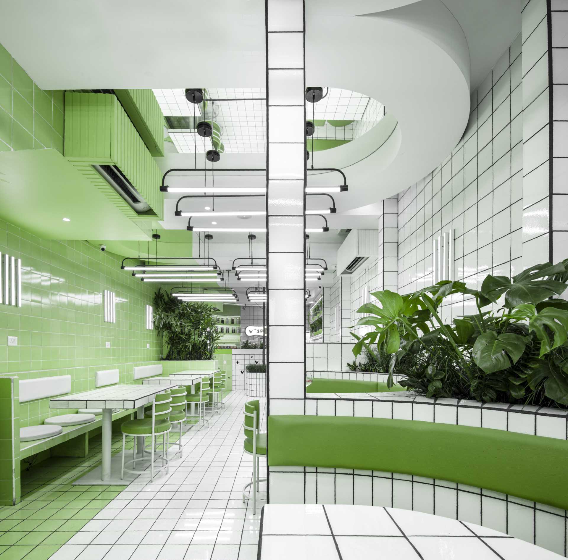 A modern green and white tiled cafe.