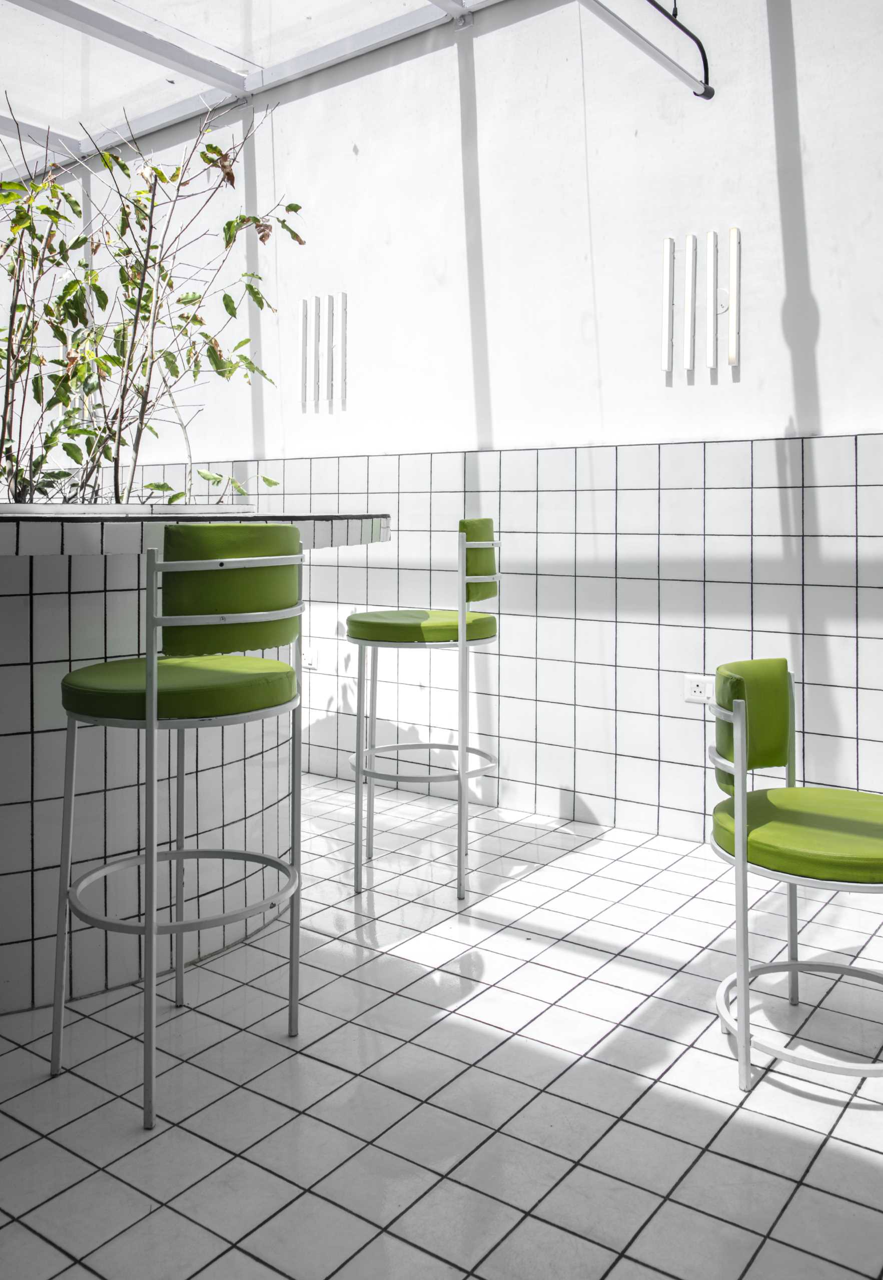 A modern green and white tiled cafe.