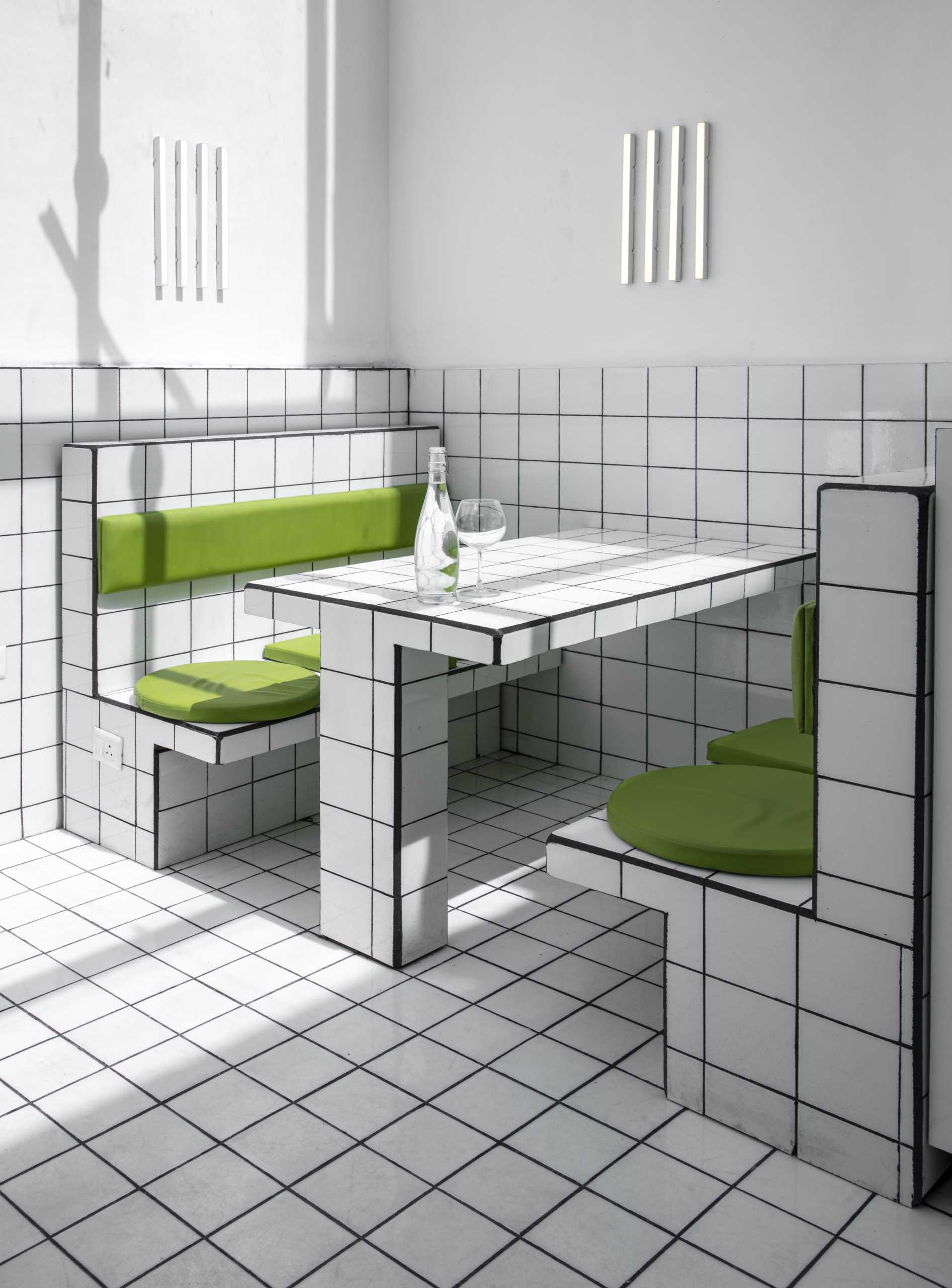 A modern green and white tiled cafe.