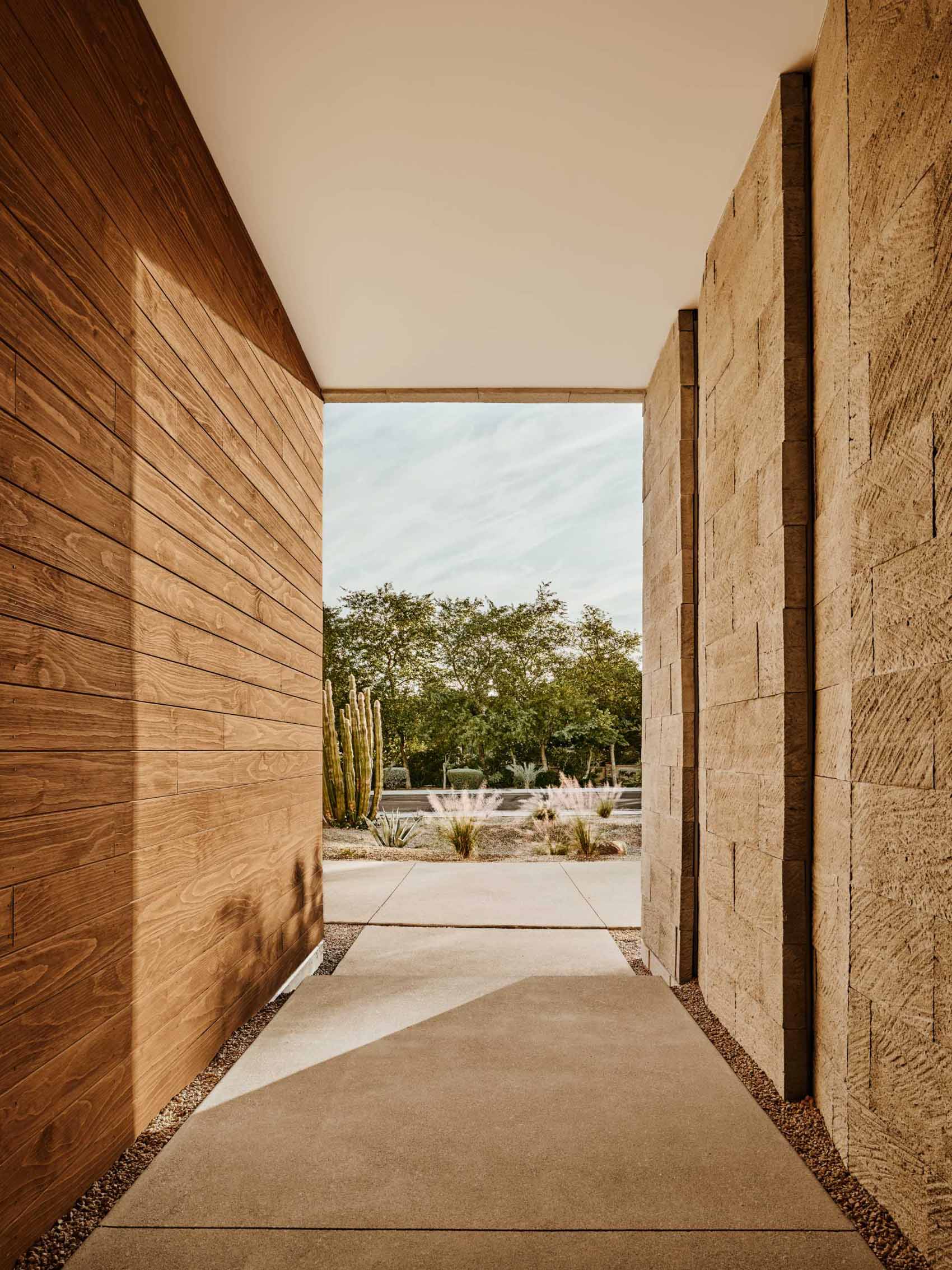 The solid travertine masses of the residence pay homage to the rugged mountains that surround the property, anchoring the dwelling to its natural context.