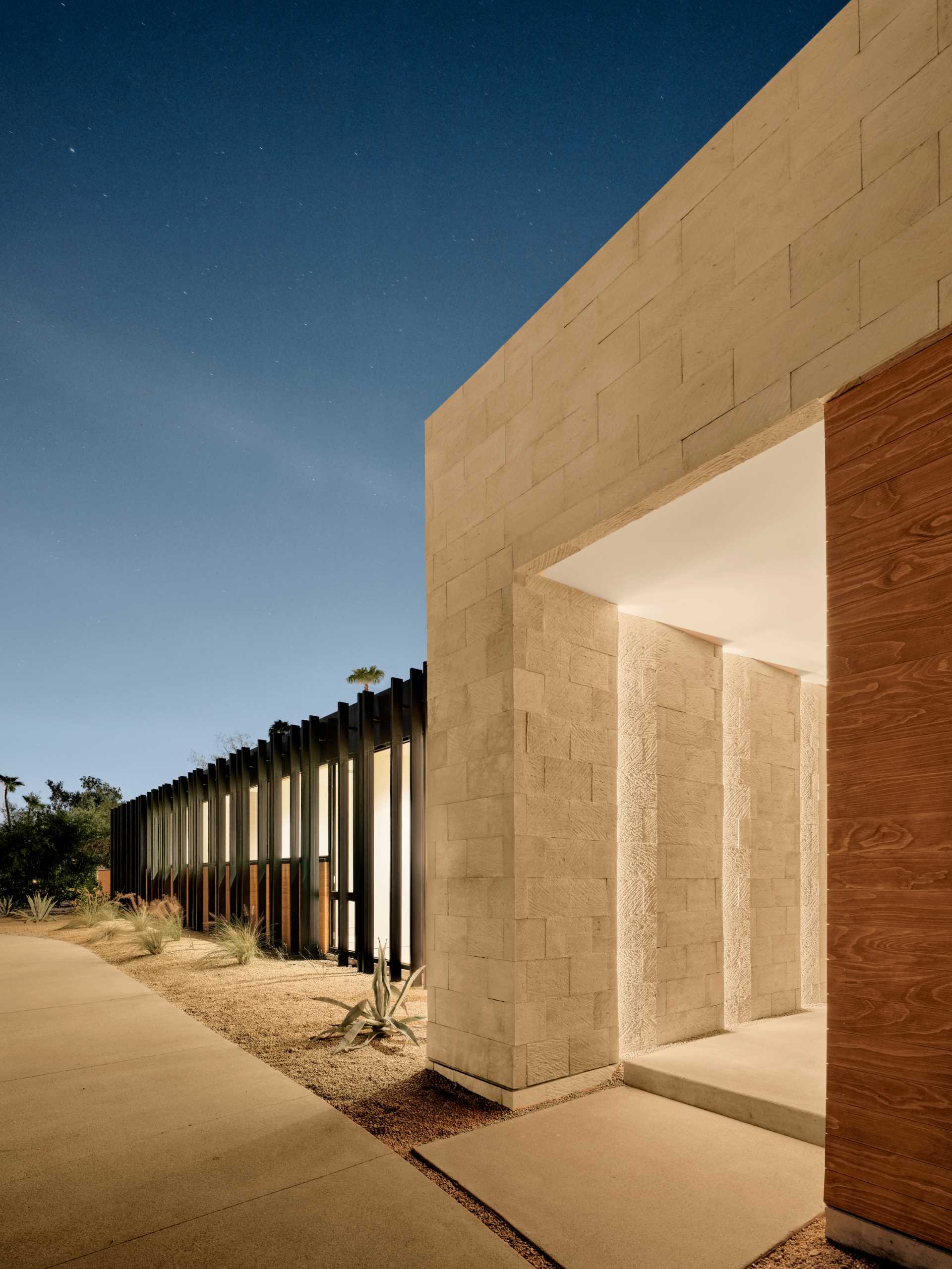 The earthy tones and textured surfaces of the travertine not only contribute to the home's aesthetic appeal but also serve as a grounding element.