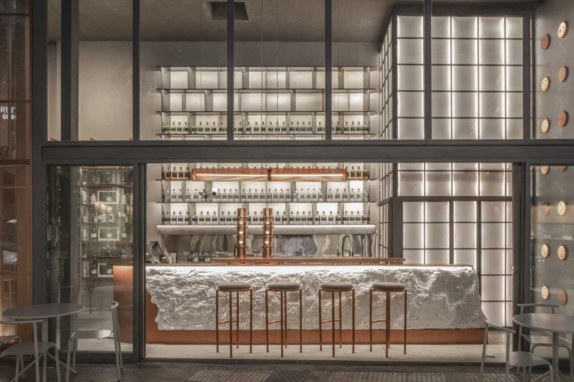 A modern gin bar has an interior inspired by materials found in the distillery.