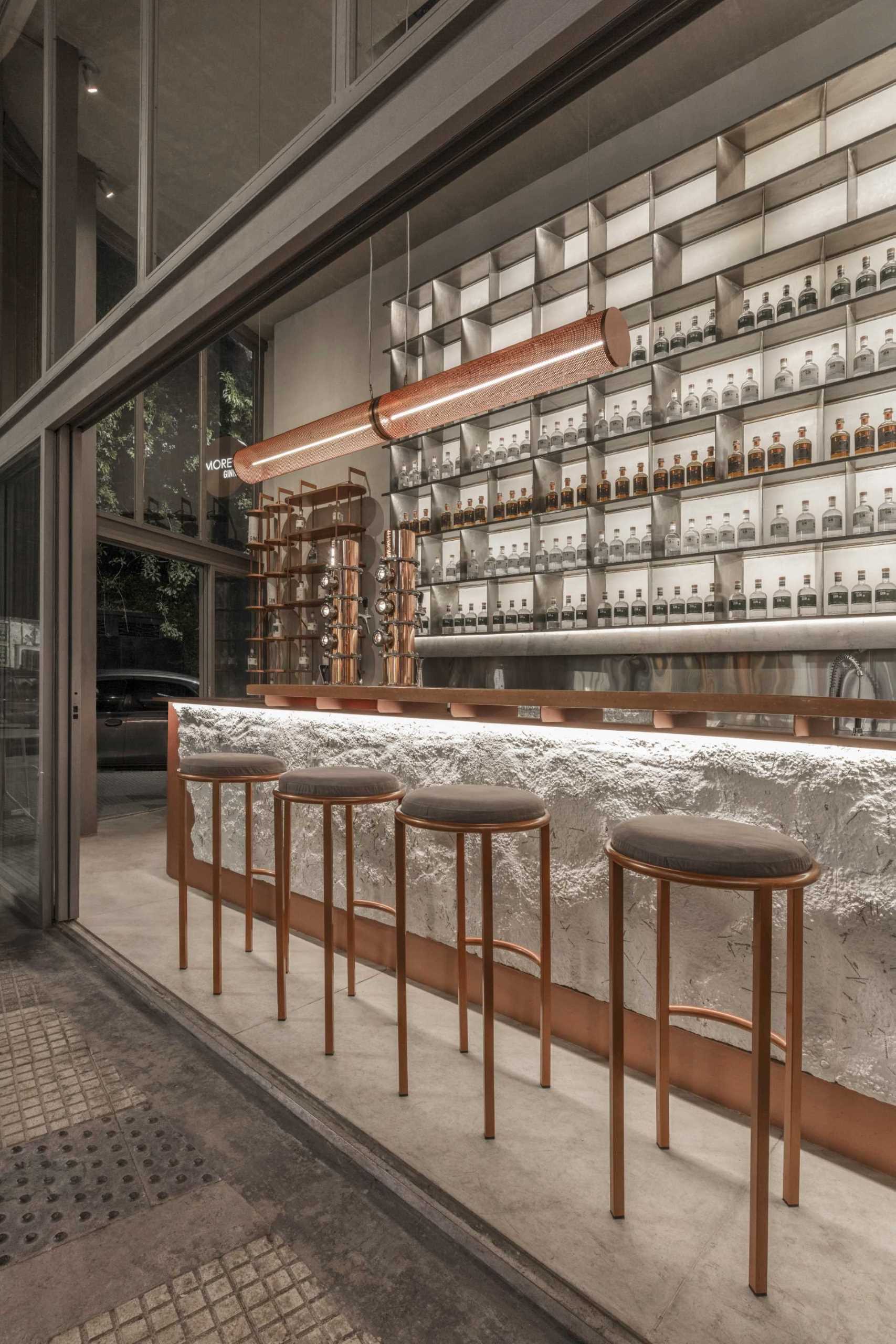 A modern gin bar has an interior inspired by materials found in the distillery.