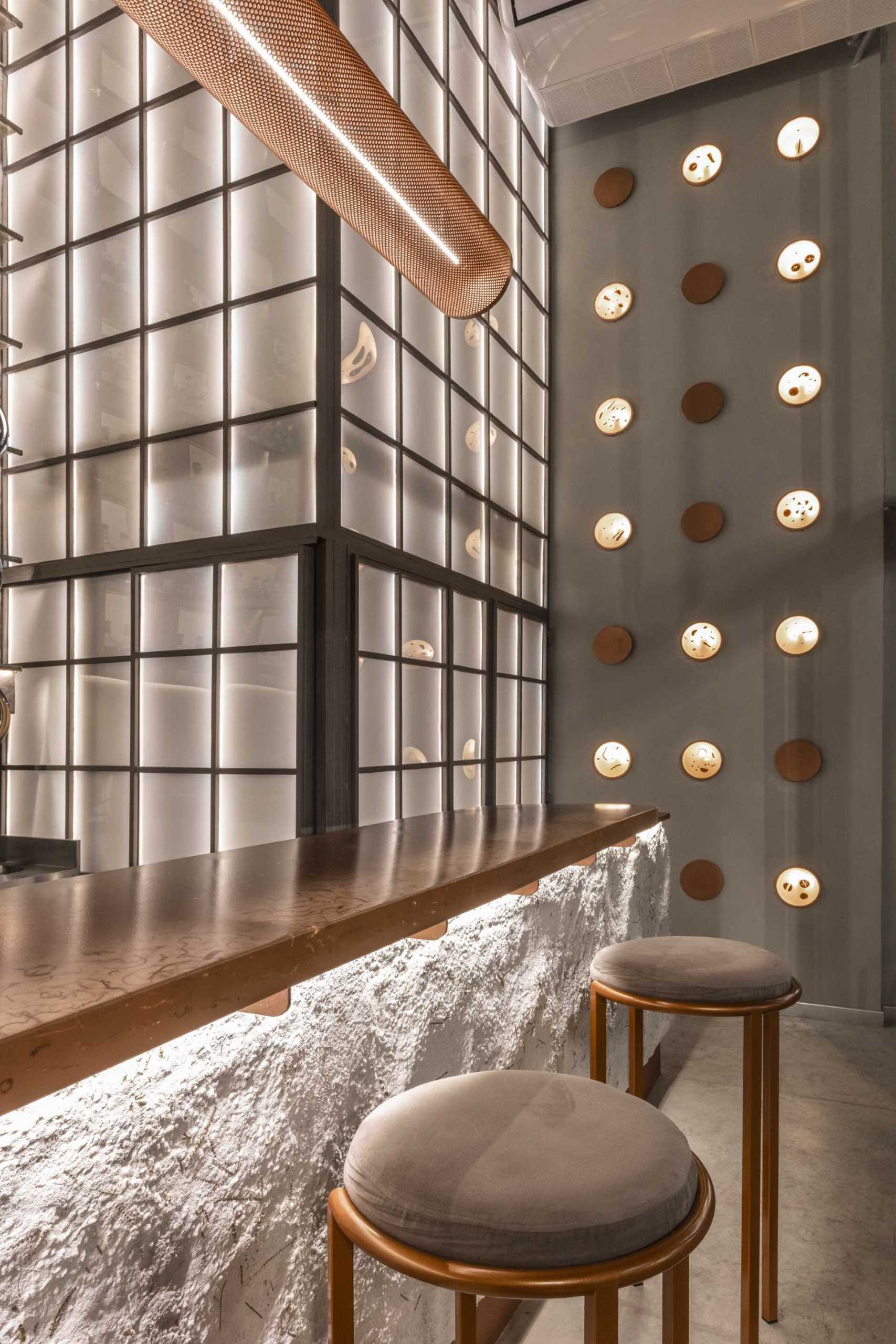 A modern gin bar has an interior inspired by materials found in the distillery.