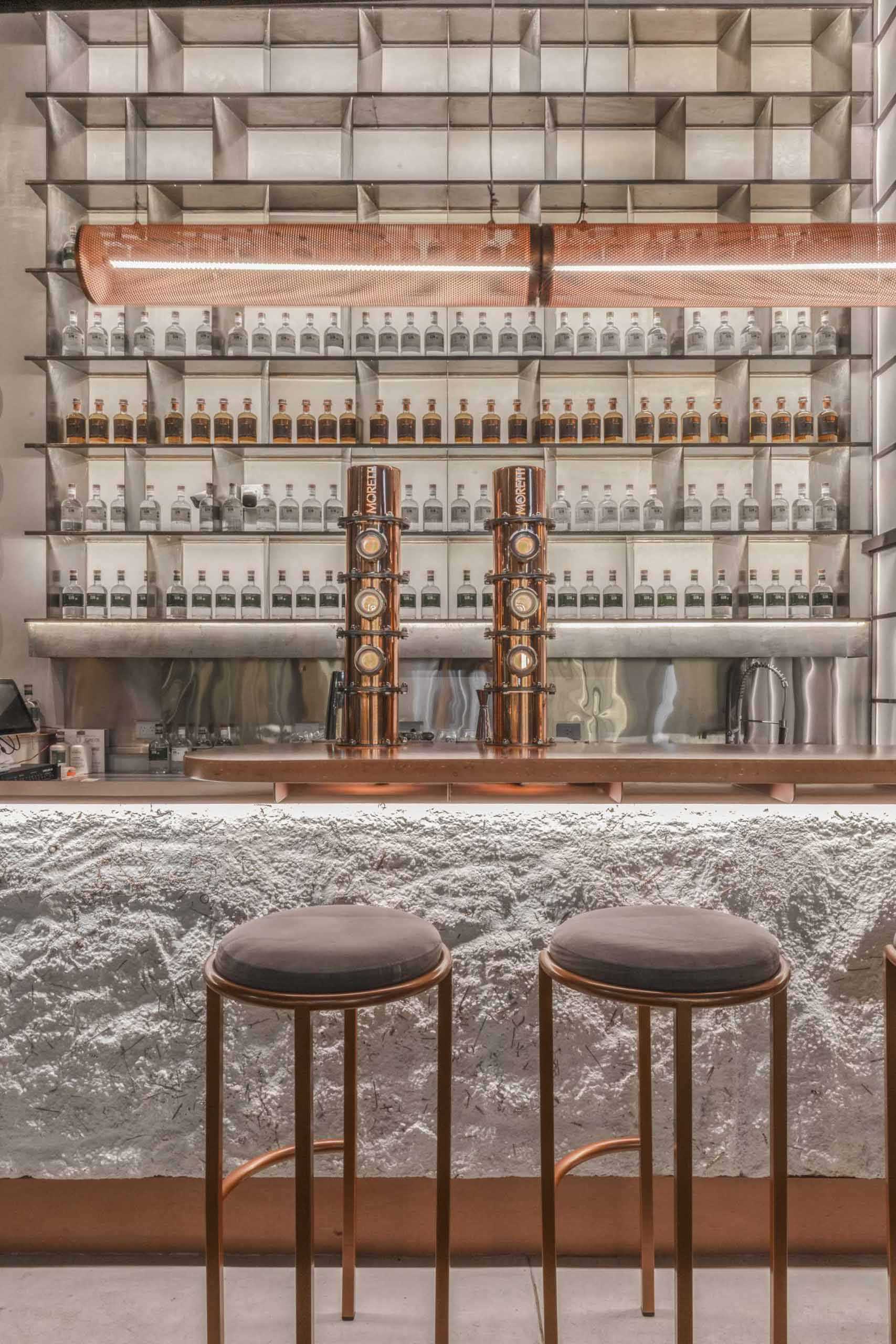 A modern gin bar has an interior inspired by materials found in the distillery.