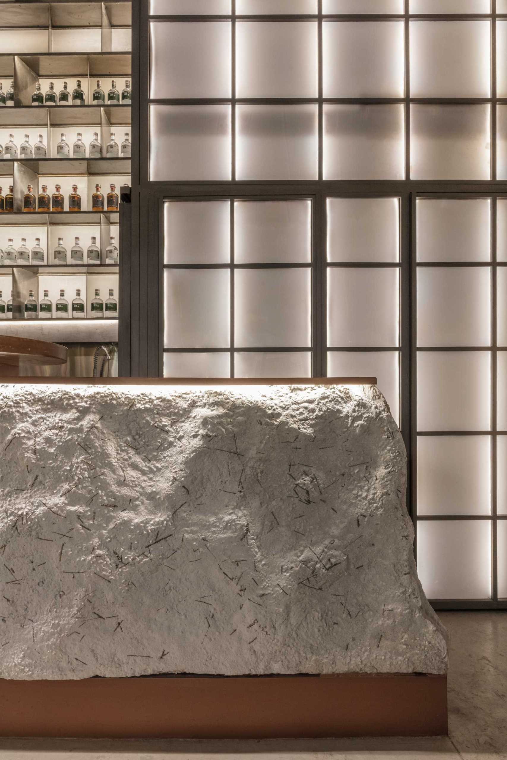 A modern gin bar has an interior inspired by materials found in the distillery.