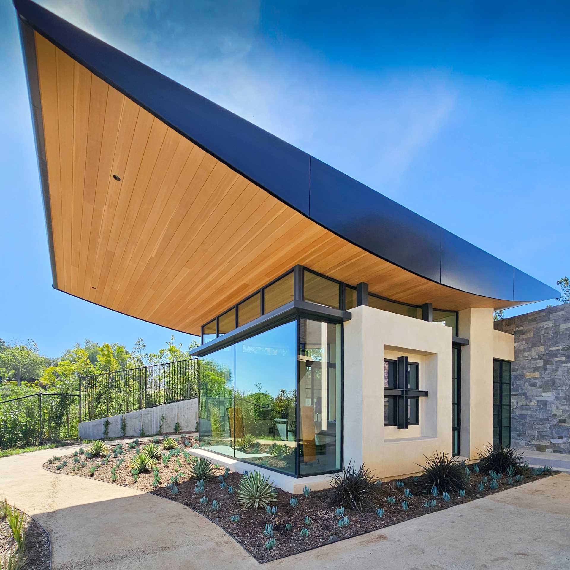 The stone and heavy timber of this home evoke a sense of stability and permanence, while steel and glass allow the structure to open up to its surroundings.