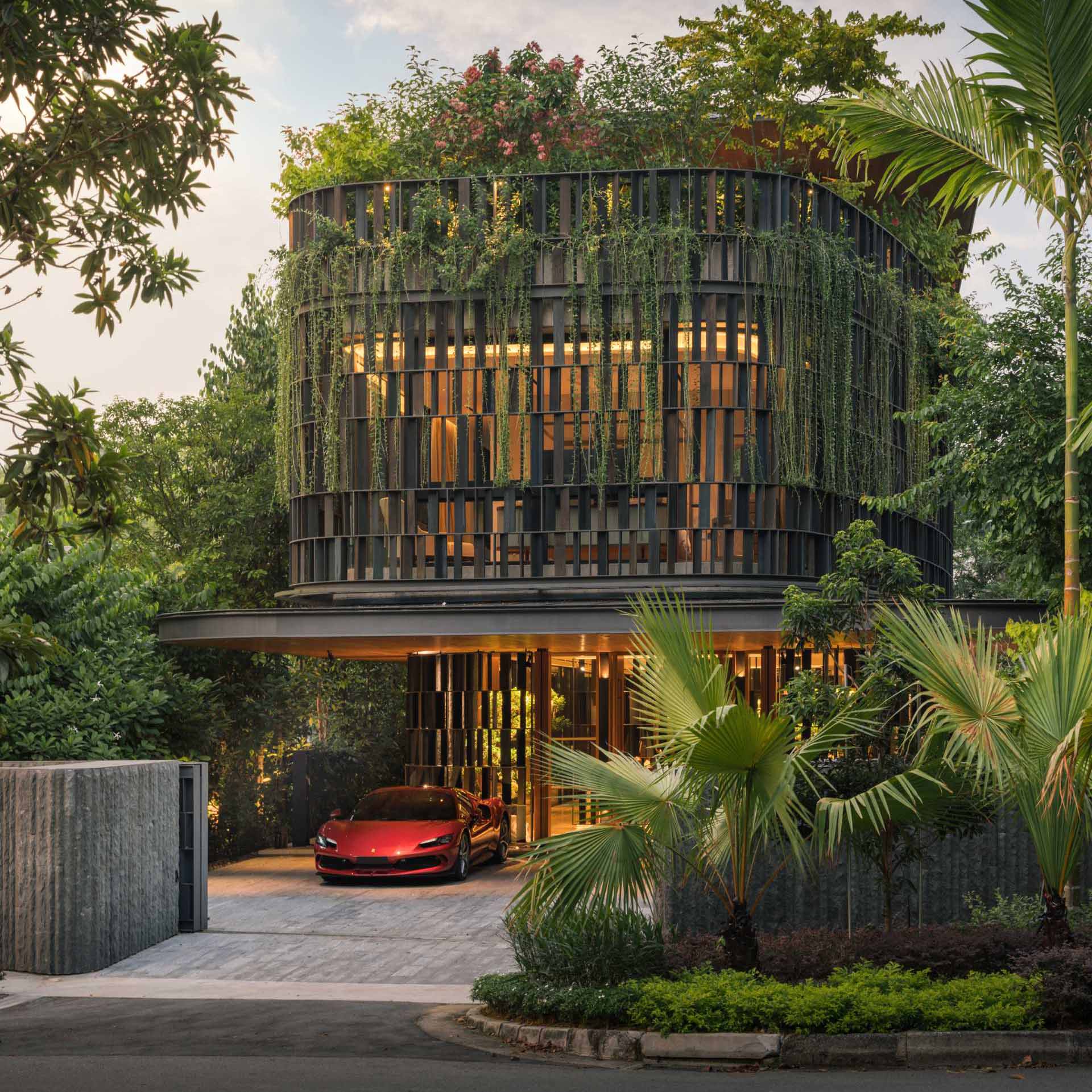 A modern house in Singapore that has plants and shade screens integrated into its design.