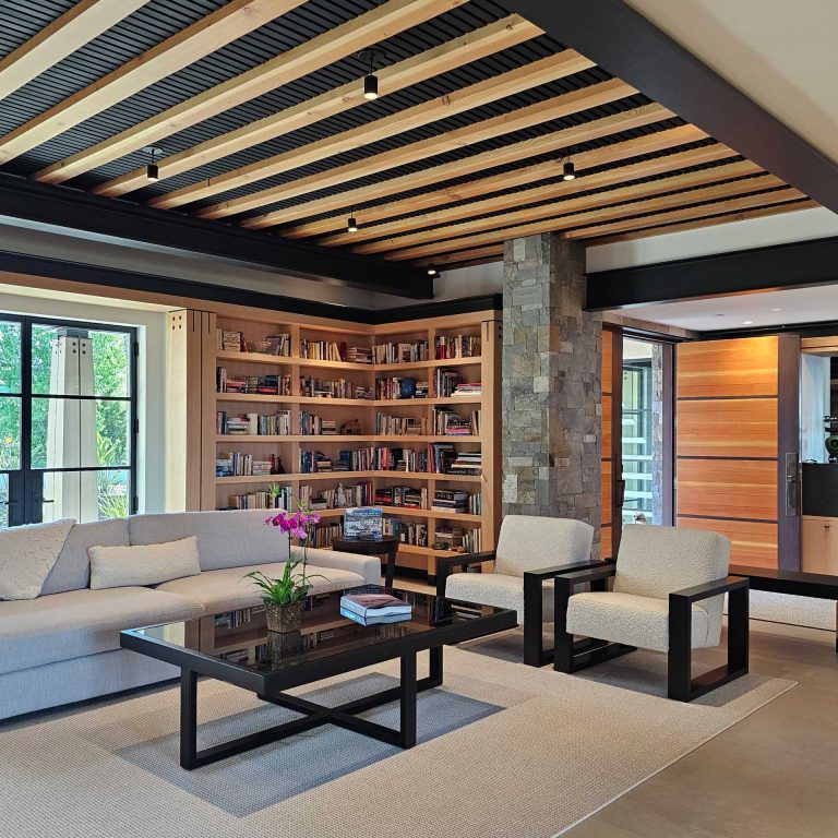 Steel, Wood, And Stone Are On Display Inside This Hillside Home