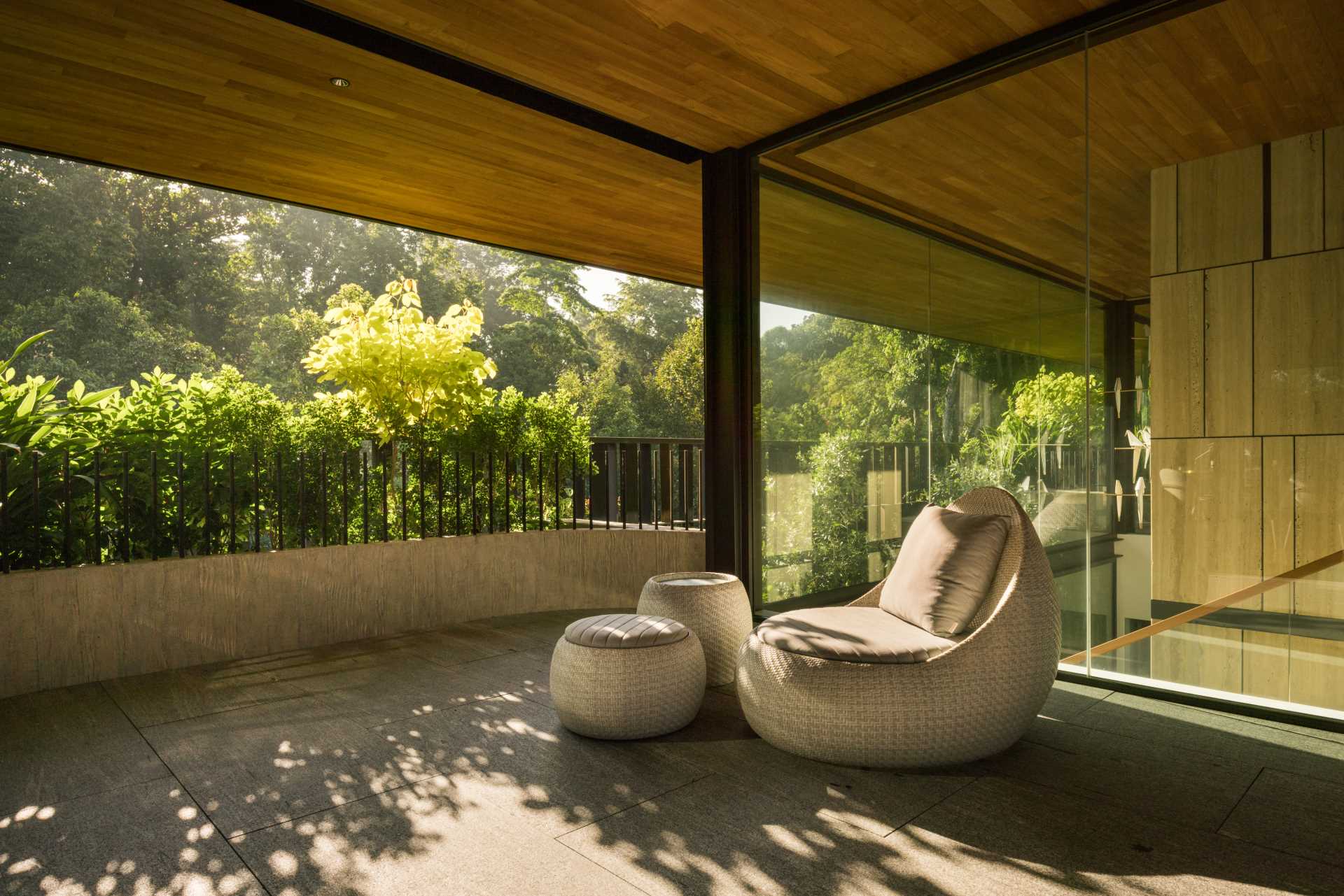 A modern house in Singapore that has plants and shade screens integrated into its design.