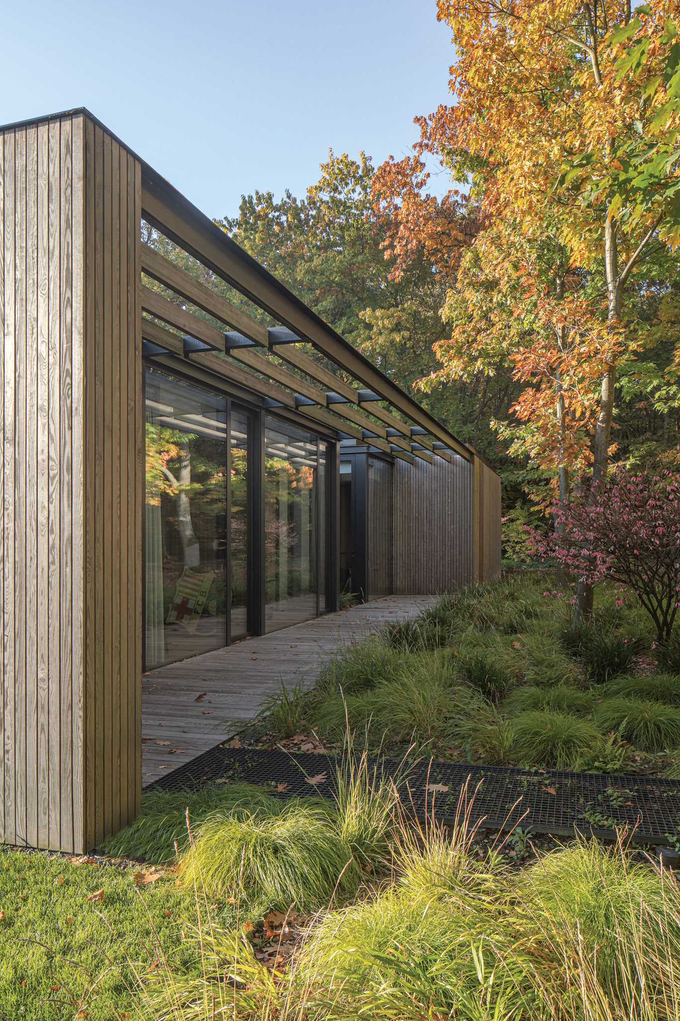 The home includes lattice pergolas that let the sunlight through to a variety of patios around the house.