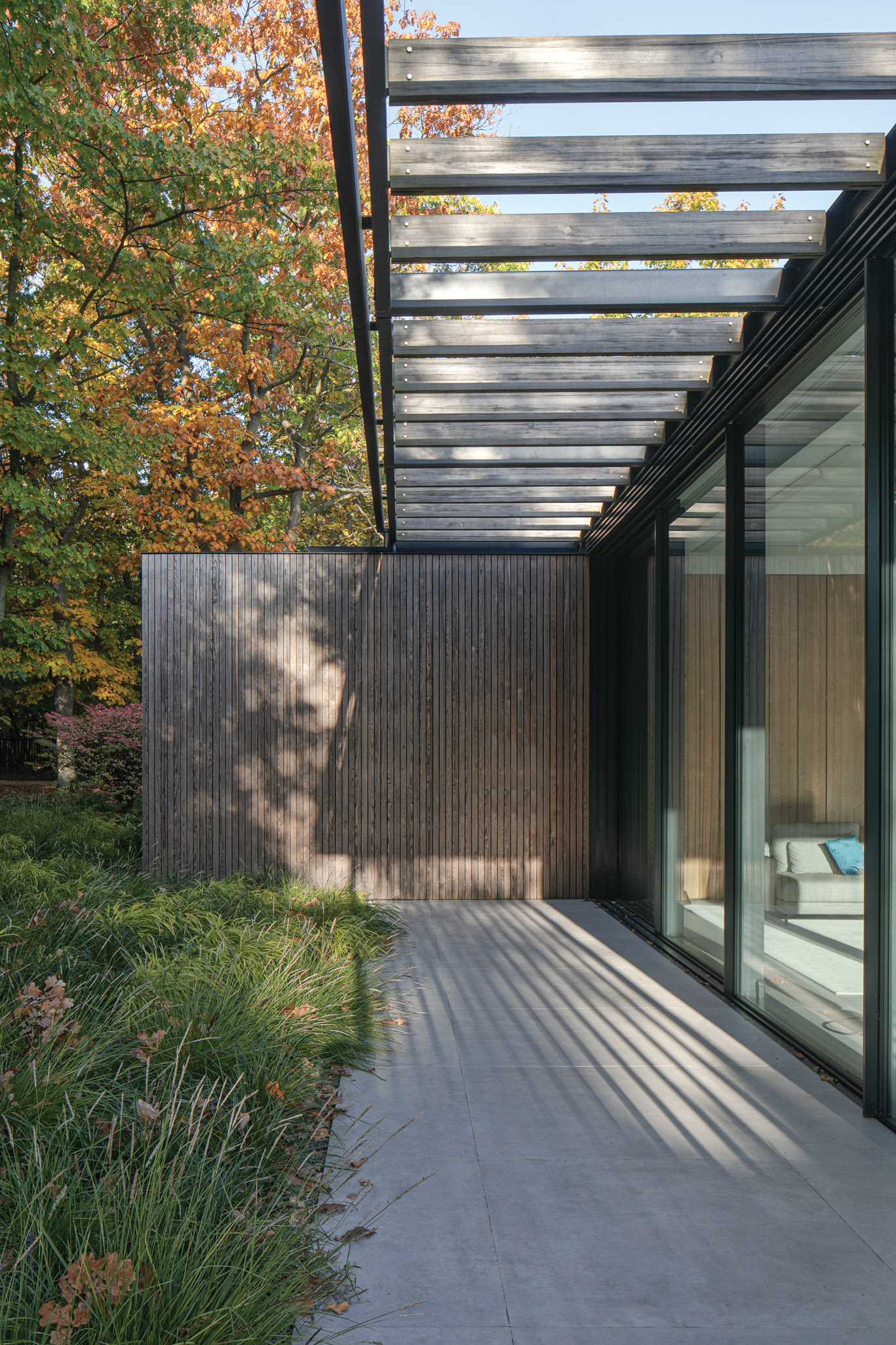 The home includes lattice pergolas that let the sunlight through to a variety of patios around the house.