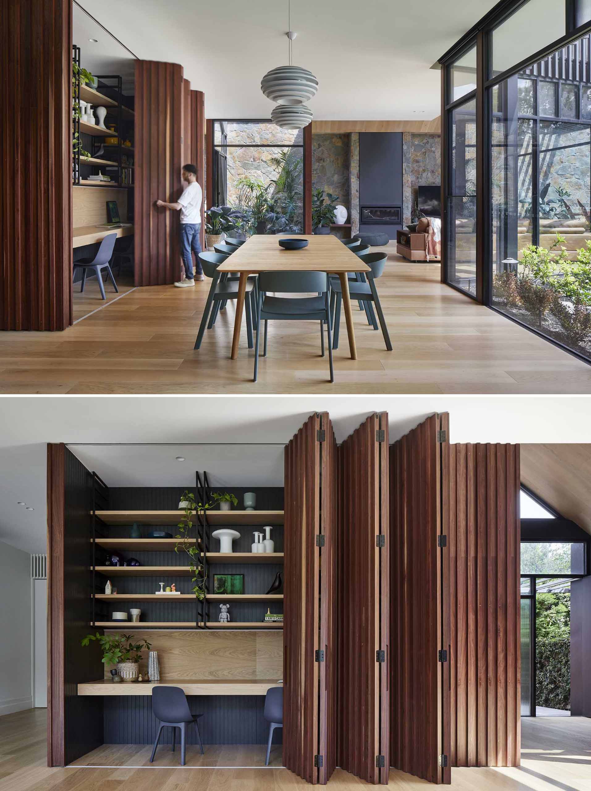 A modern home interior includes a wood accent wall in the dining room that opens to reveal a hidden office for two.