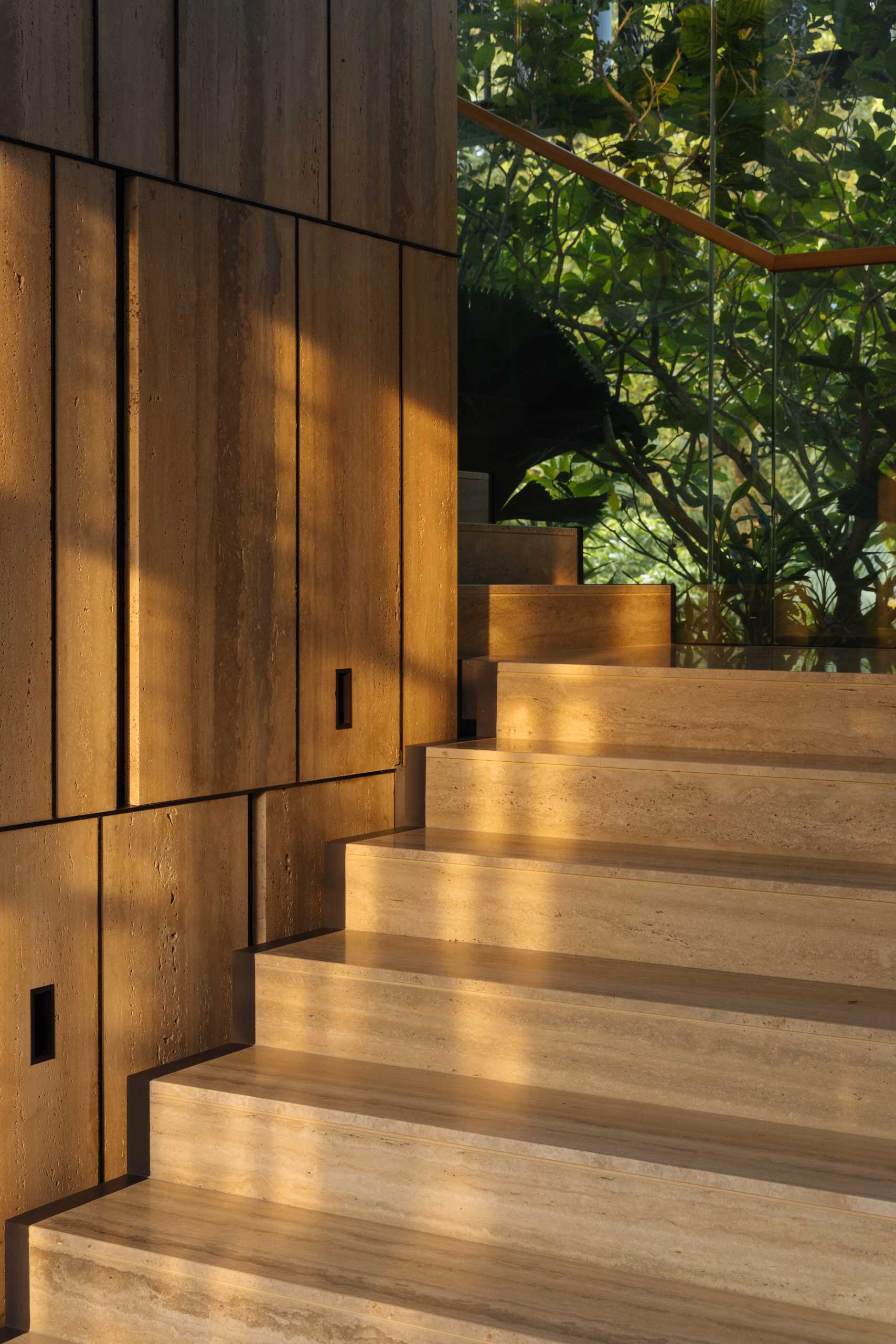 A modern house with travertine stairs.