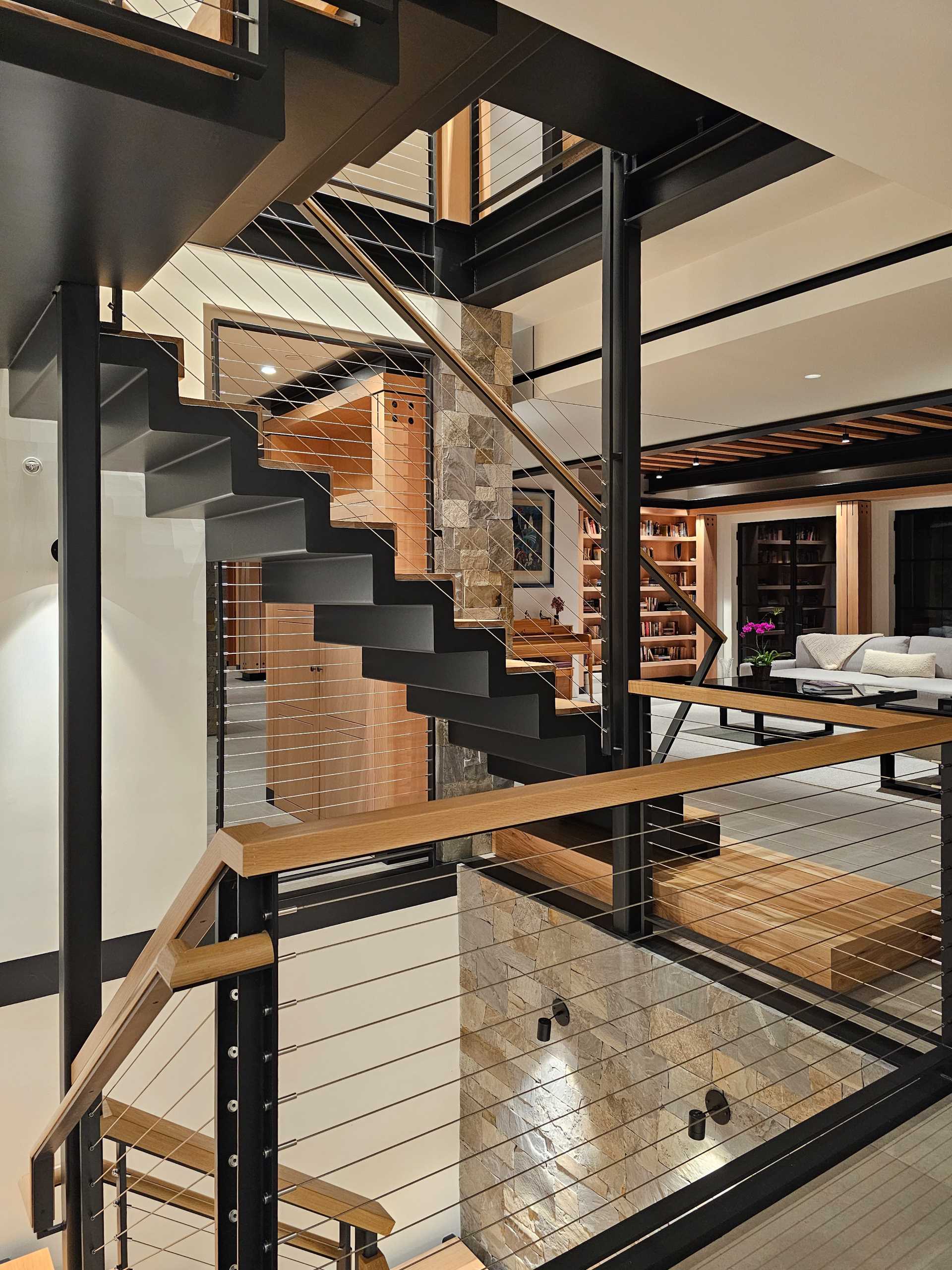 A modern home with steel and wood stairs.