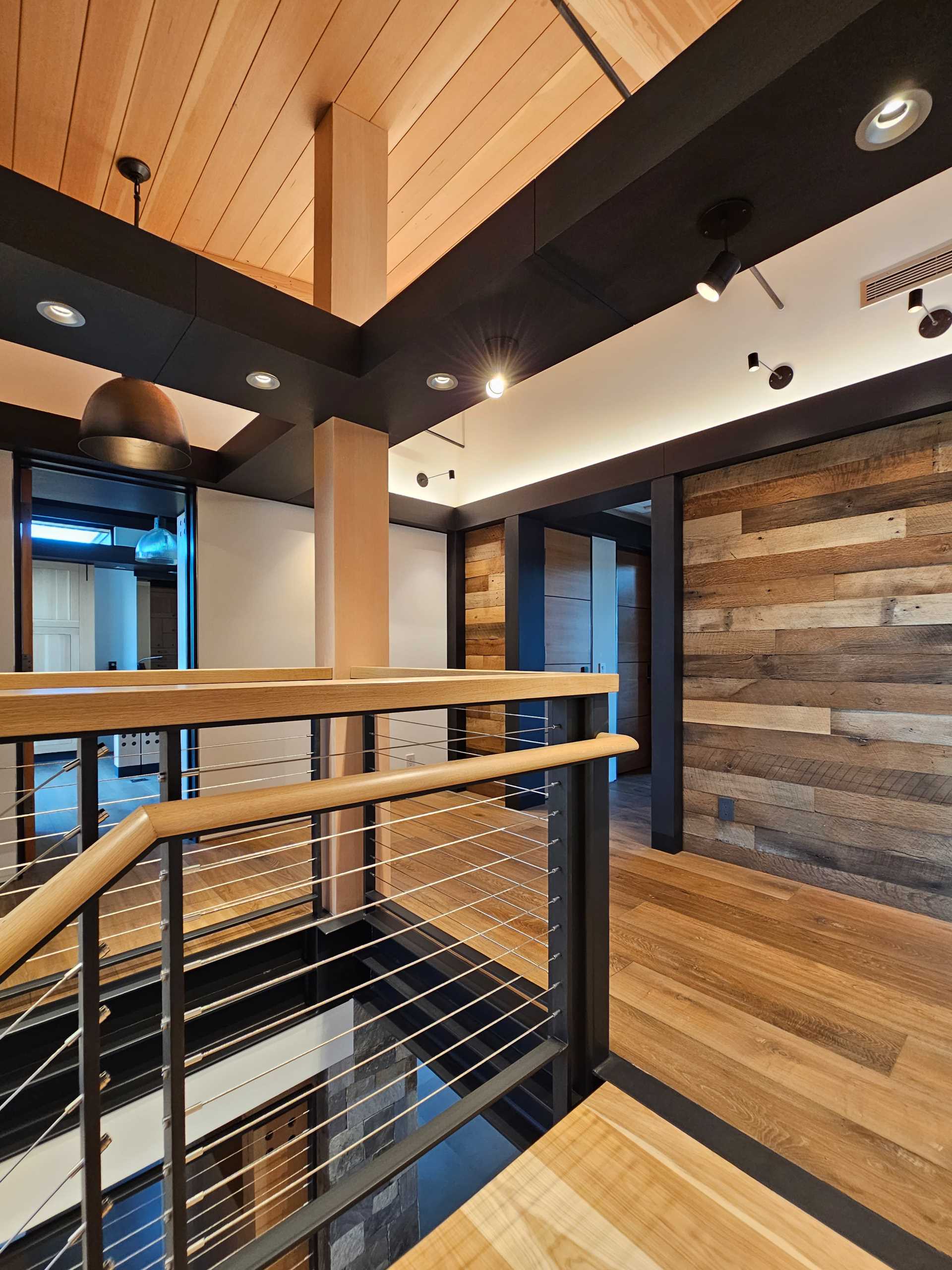 A modern home with steel and wood stairs.