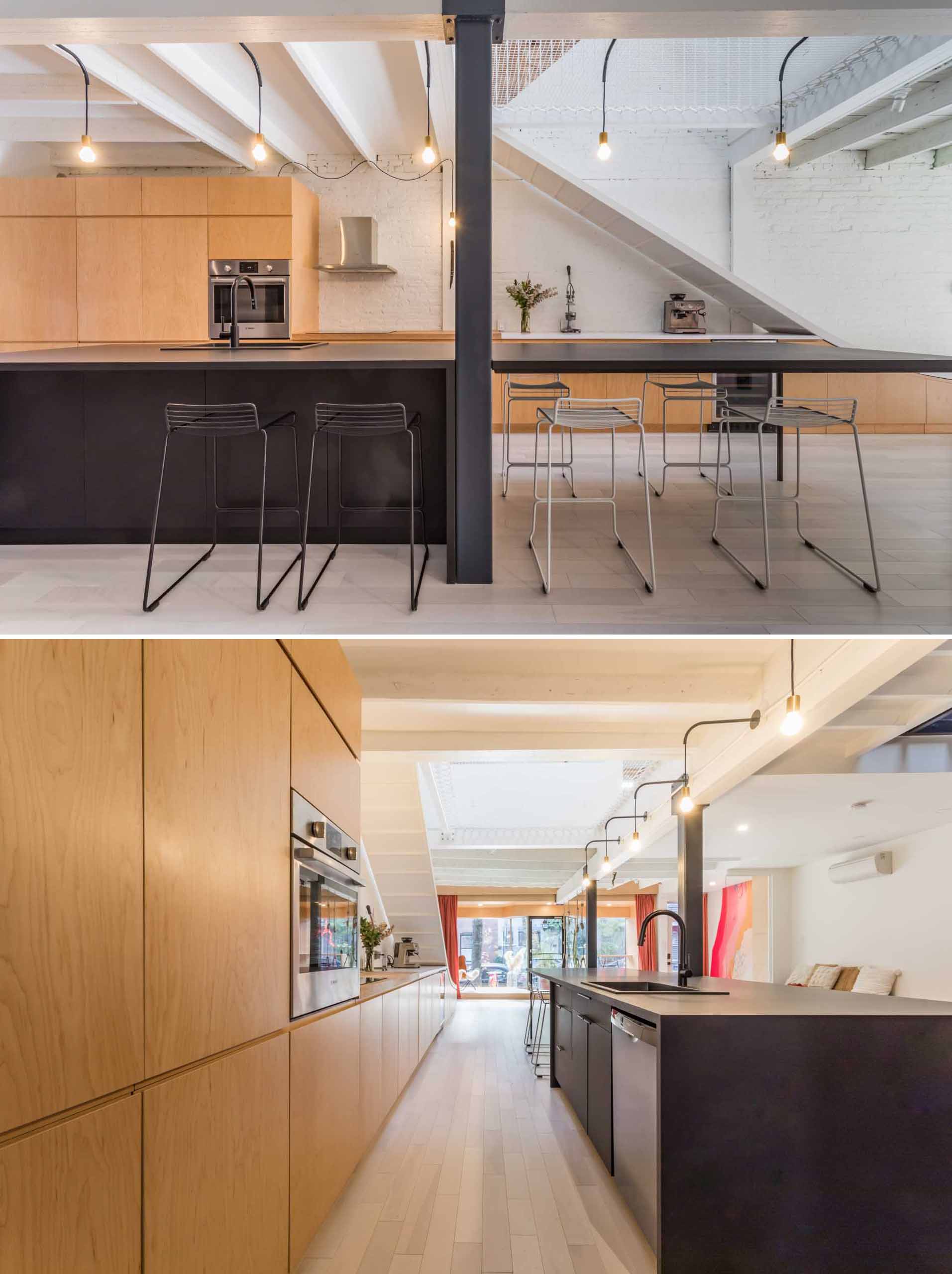 The open-plan interior of the social areas of the ،me also includes the dining area and kitchen, where wood and black cabinetry and countertops have been paired for a contemporary appearance.