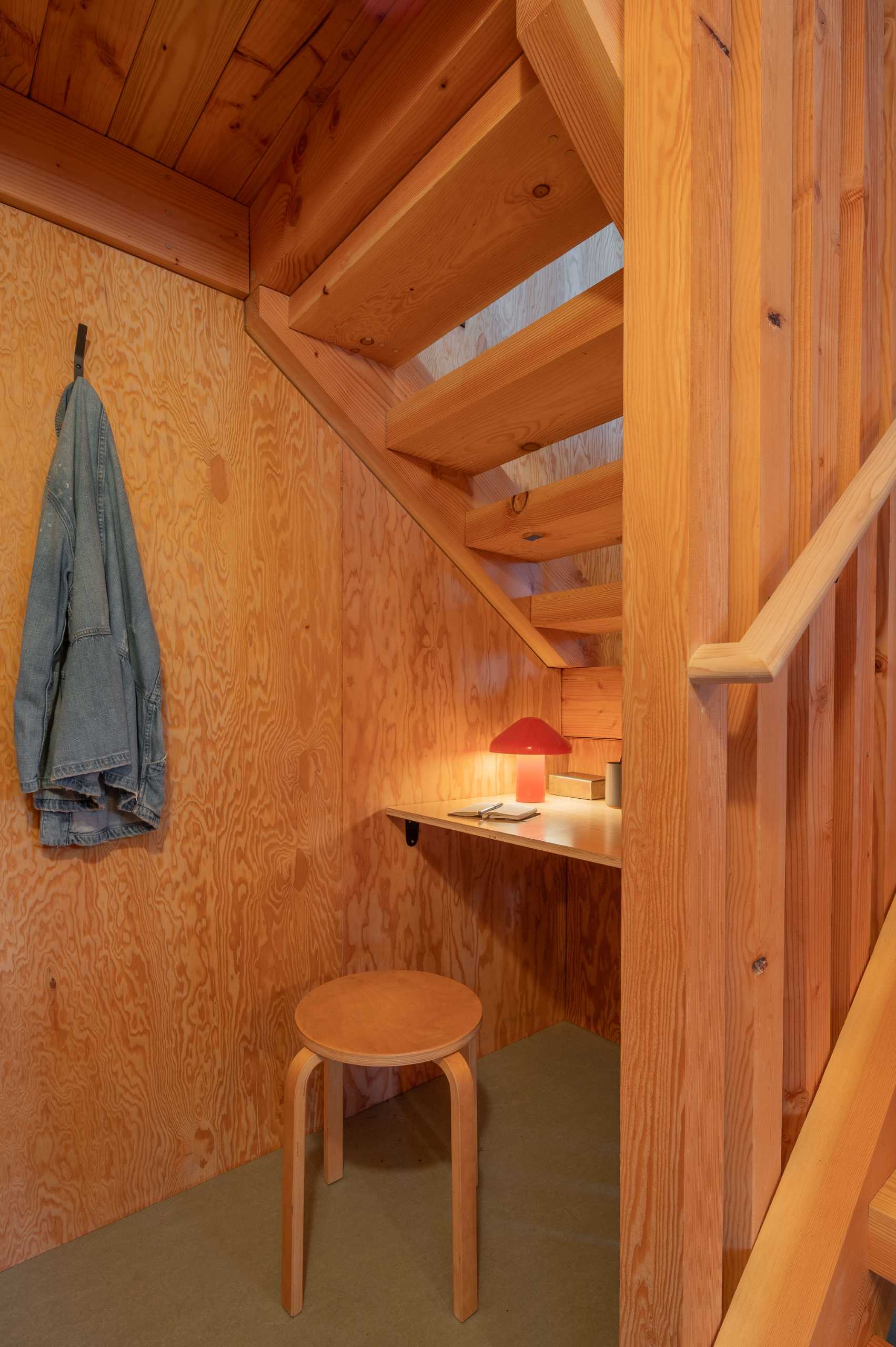 A small desk has been added underneath the stairs that lead to the lounge and sleeping areas.