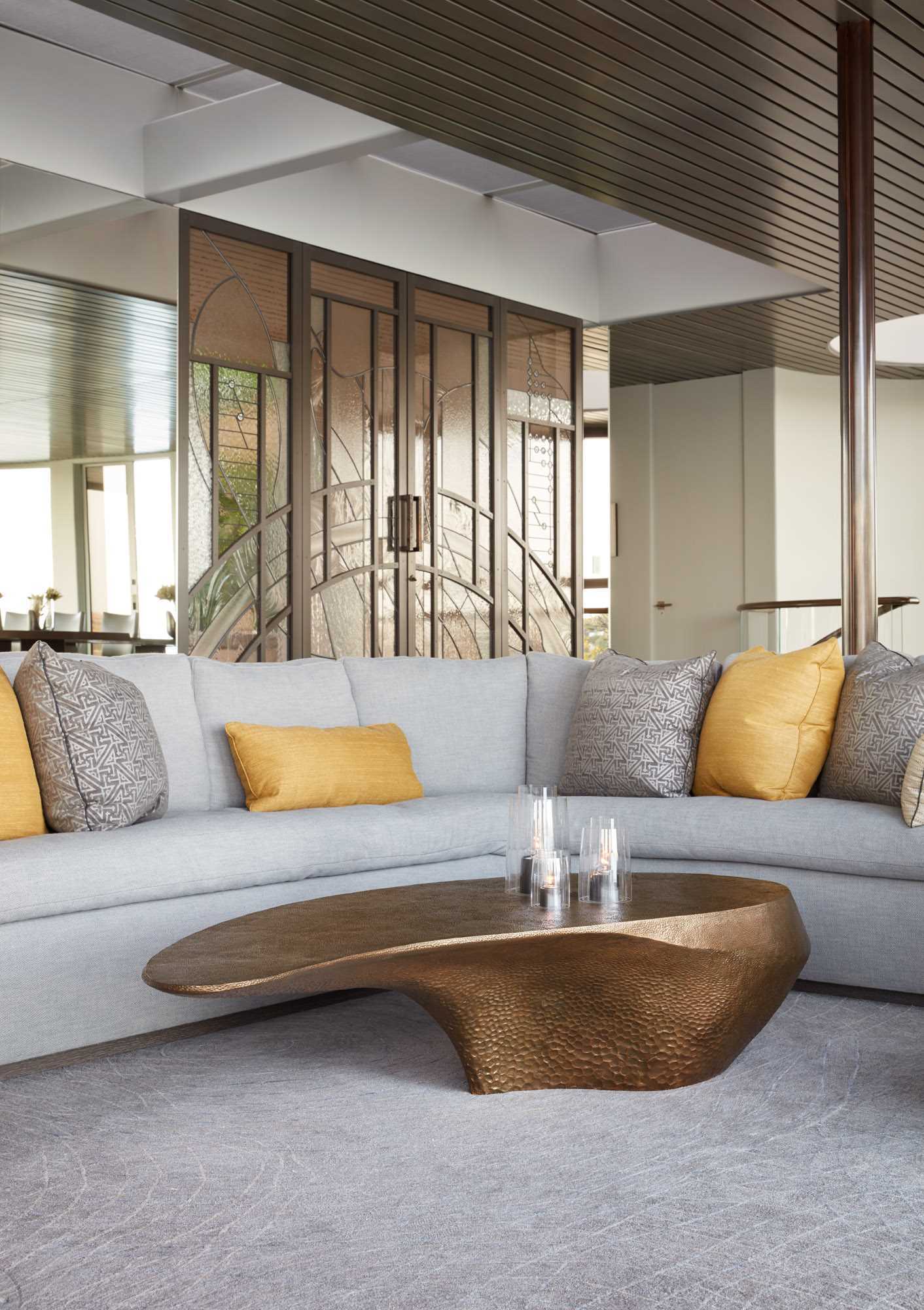 A custom curved sofa in the living room was made to fit perfectly with the room’s curved windows.
