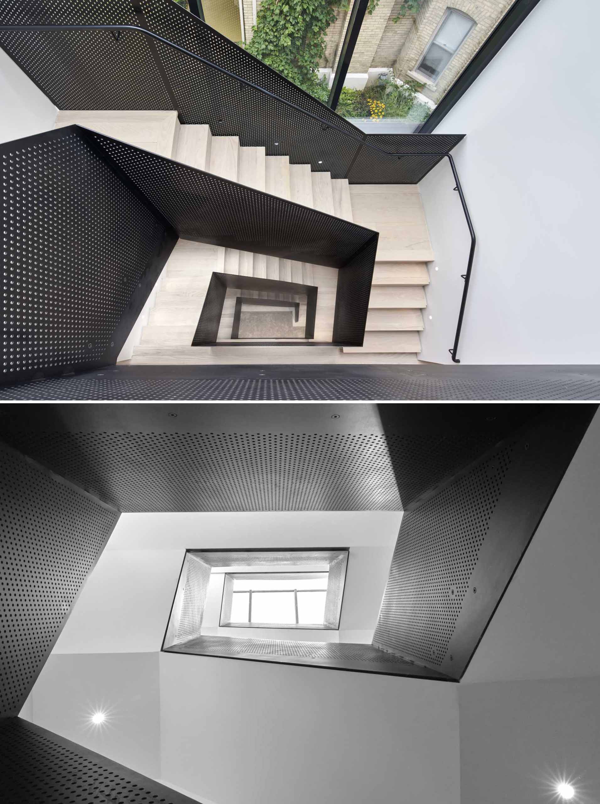 Wood stairs with perforated black metal railings connect the multiple levels of the home 