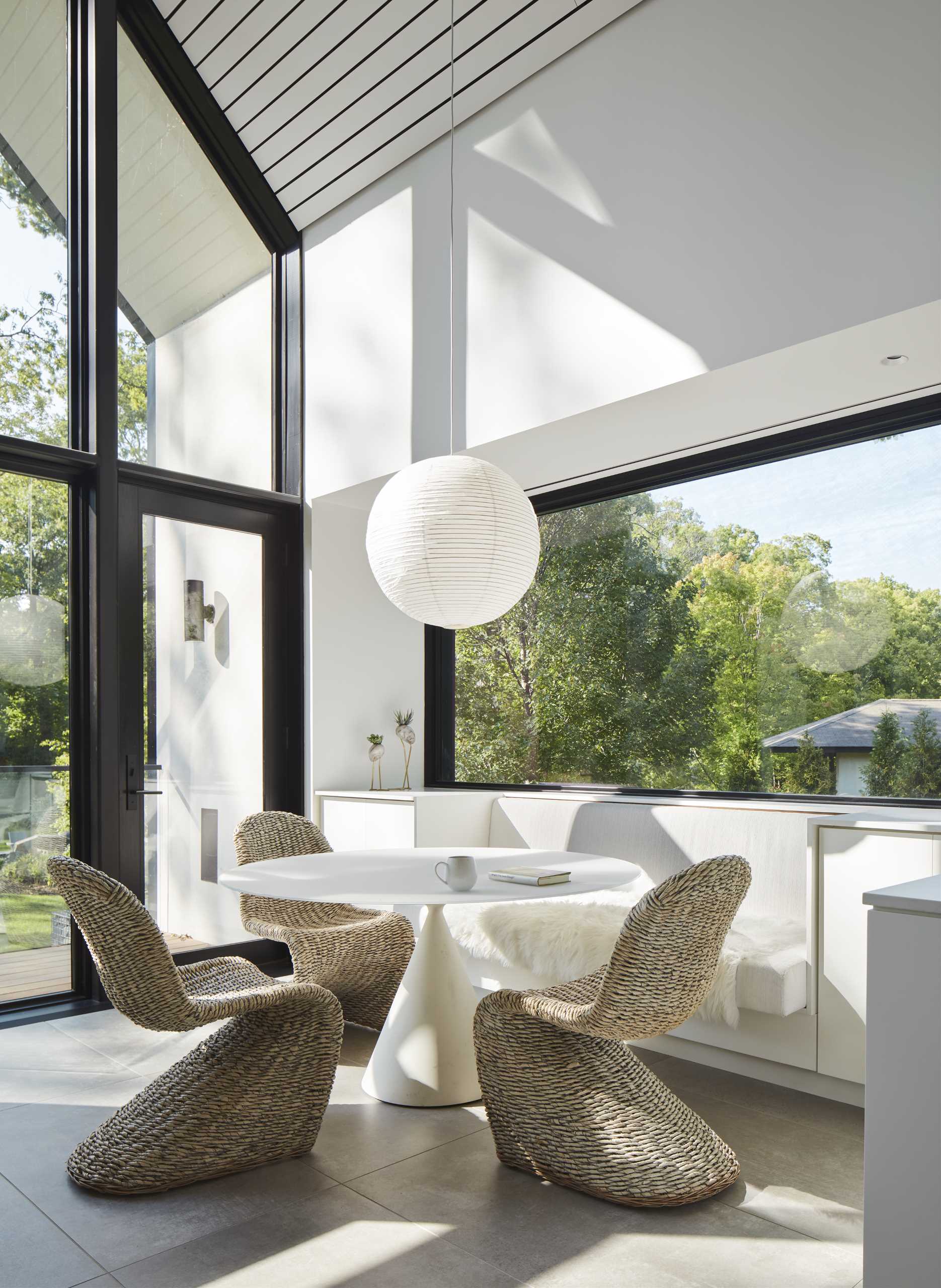 A breakfast dining area with a built-in banquette and a round table.