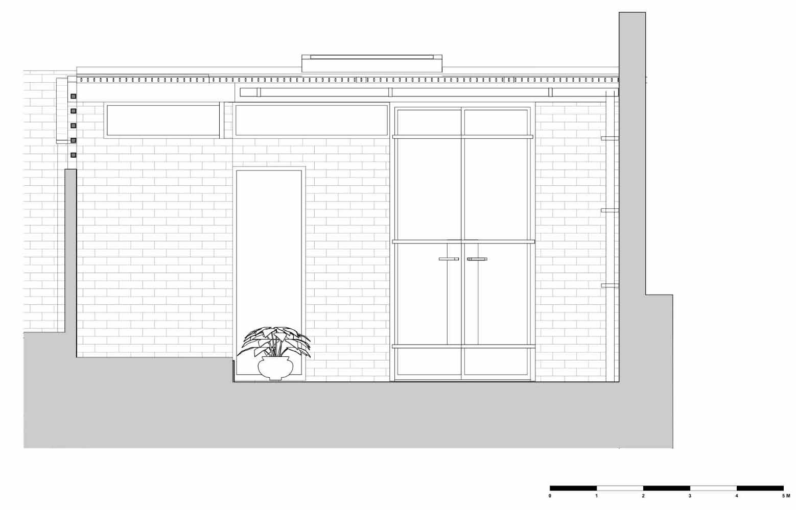 A new garden studio for a writer that includes a green roof, sitting area, built-in shelving, and a bathroom.