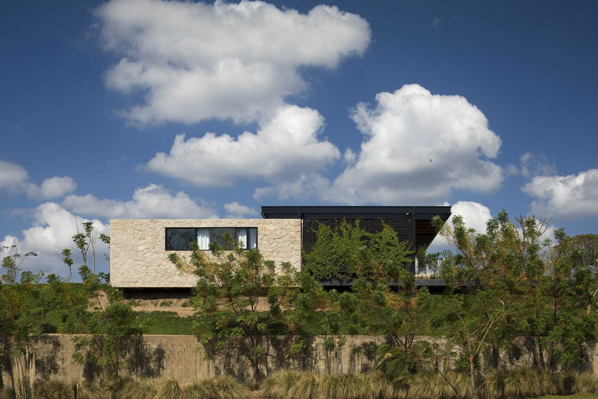 A modern house with stone walls.