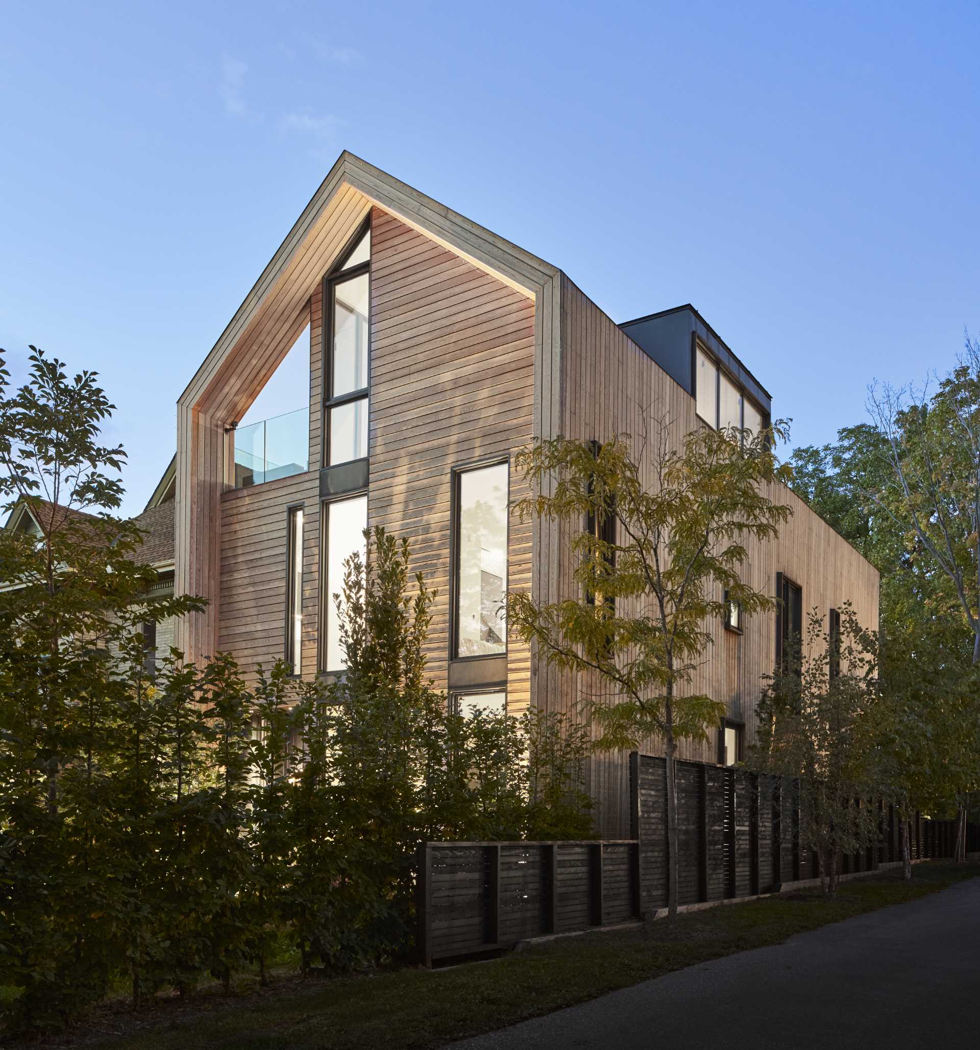 This home is clad in pre-treated kiln-dried wood siding to exude warmth and texture, while a prefinished standing seam metal roof adds a contemporary element. 