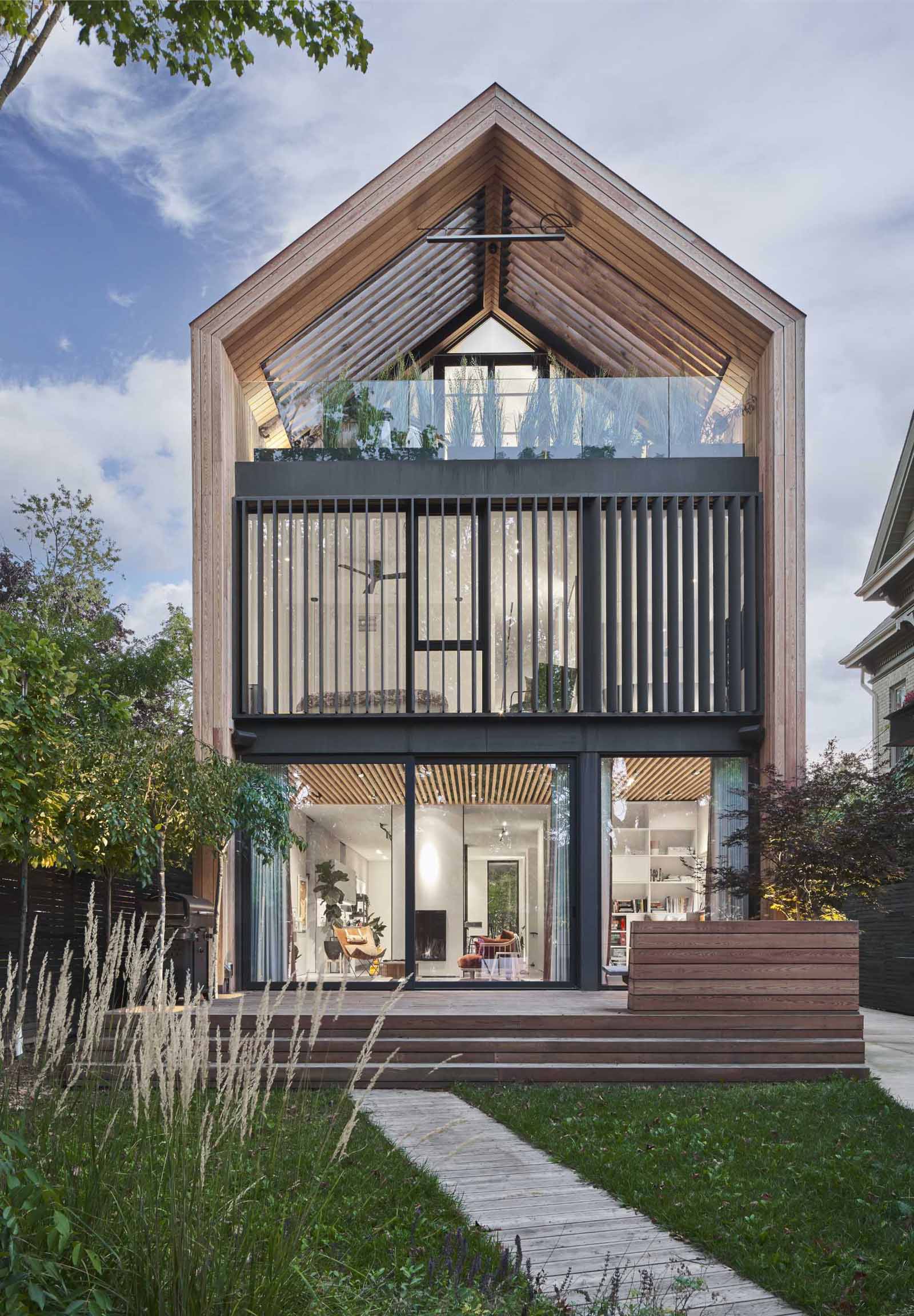 This home is clad in pre-treated kiln-dried wood siding to exude warmth and texture, while a prefinished standing seam metal roof adds a contemporary element. 