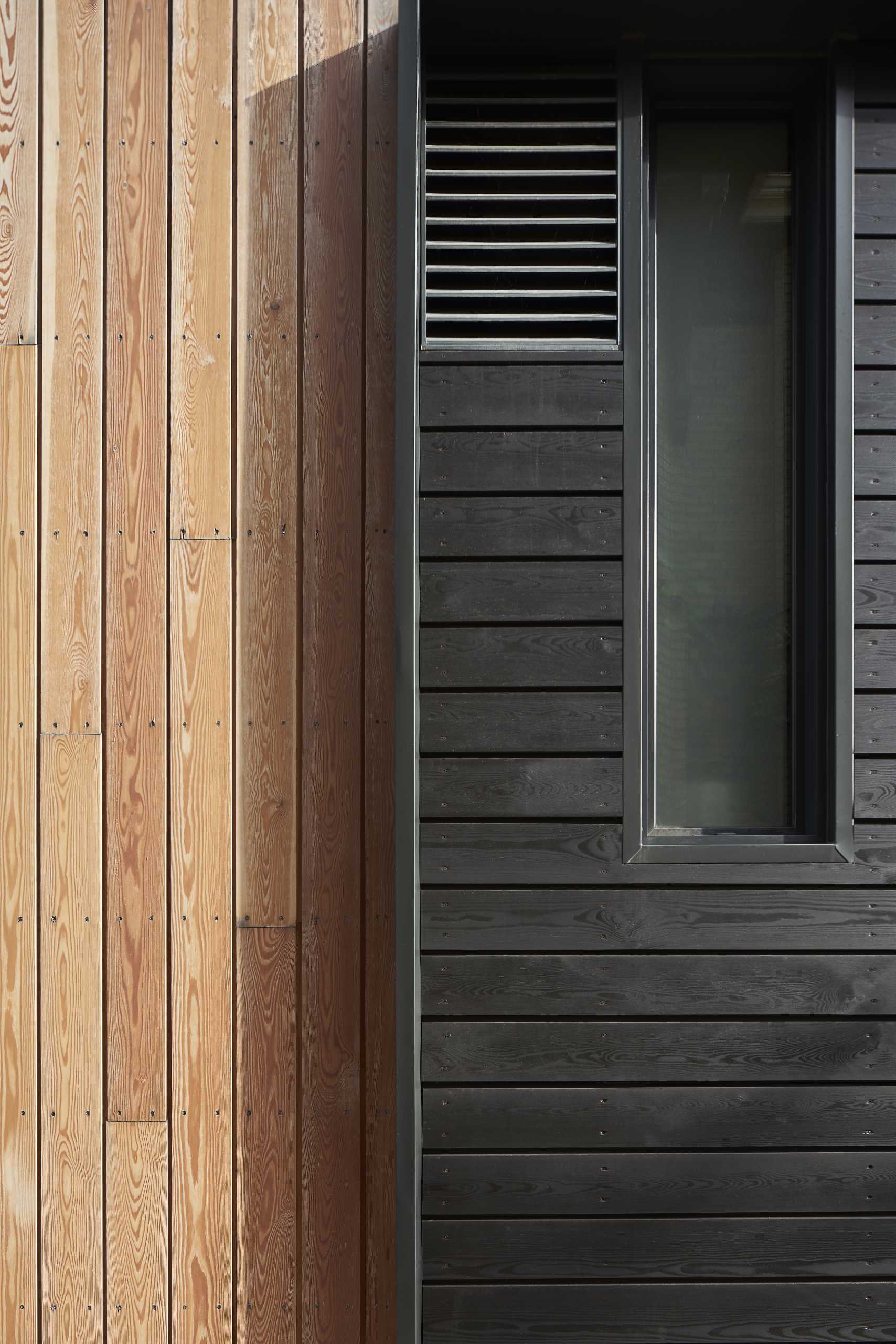 This home is clad in pre-treated kiln-dried wood siding to exude warmth and texture, while a prefinished standing seam metal roof adds a contemporary element. 