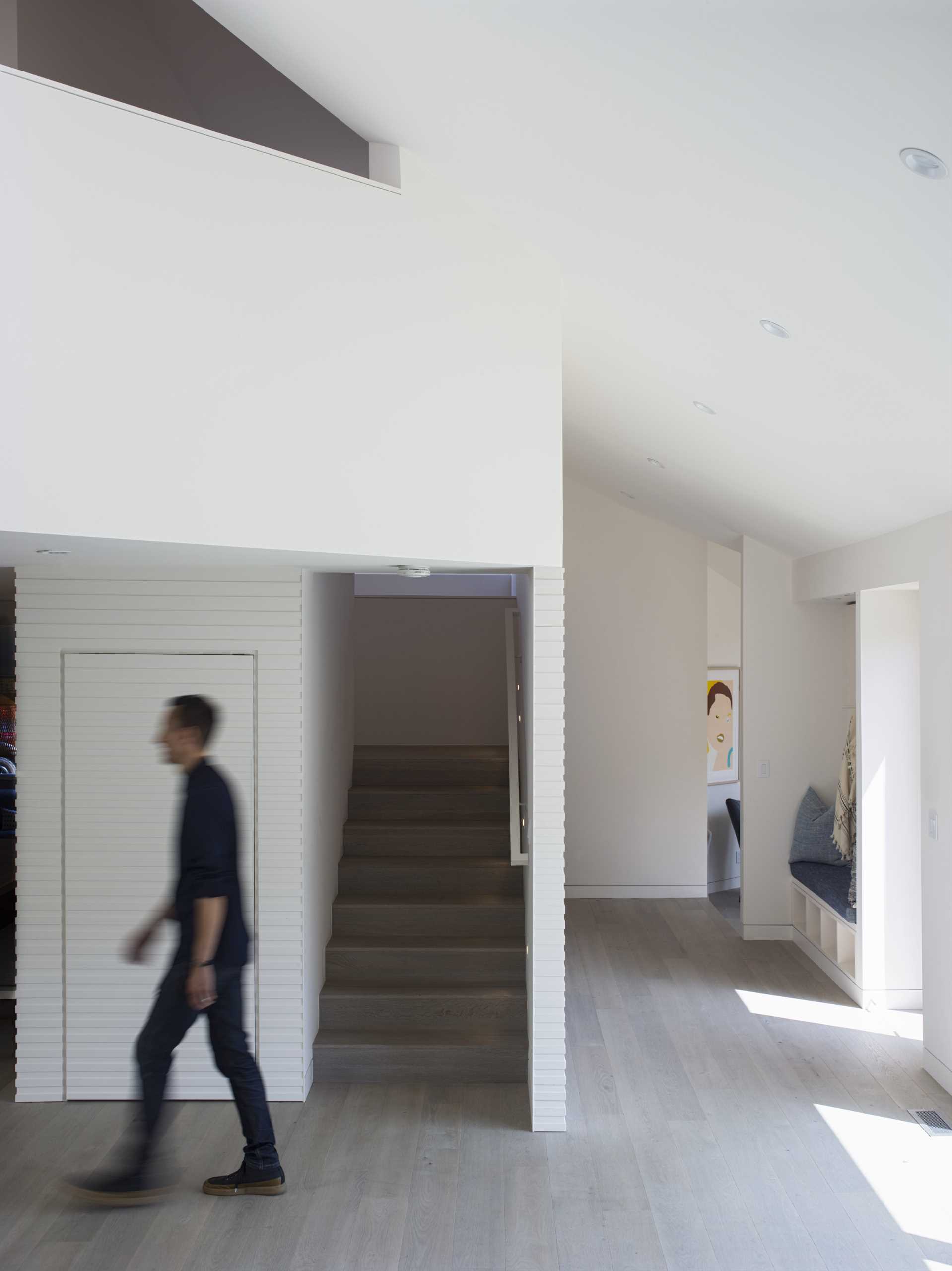 A modern house with wood stairs.