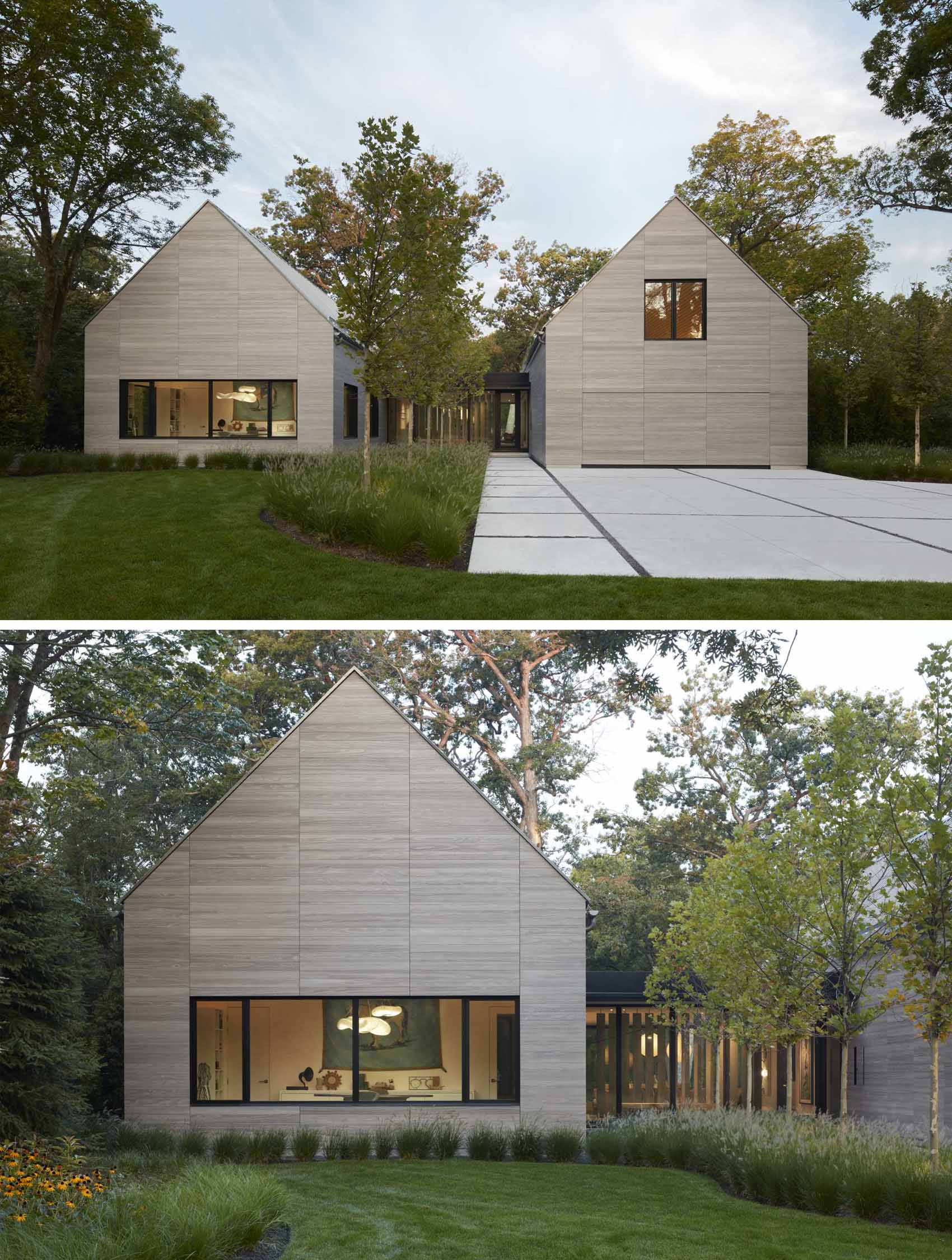 The exterior of this modern home with two gables, is composed of warm gray Accoya siding, deeply inset windows, and zinc-colored standing seam roofing. 