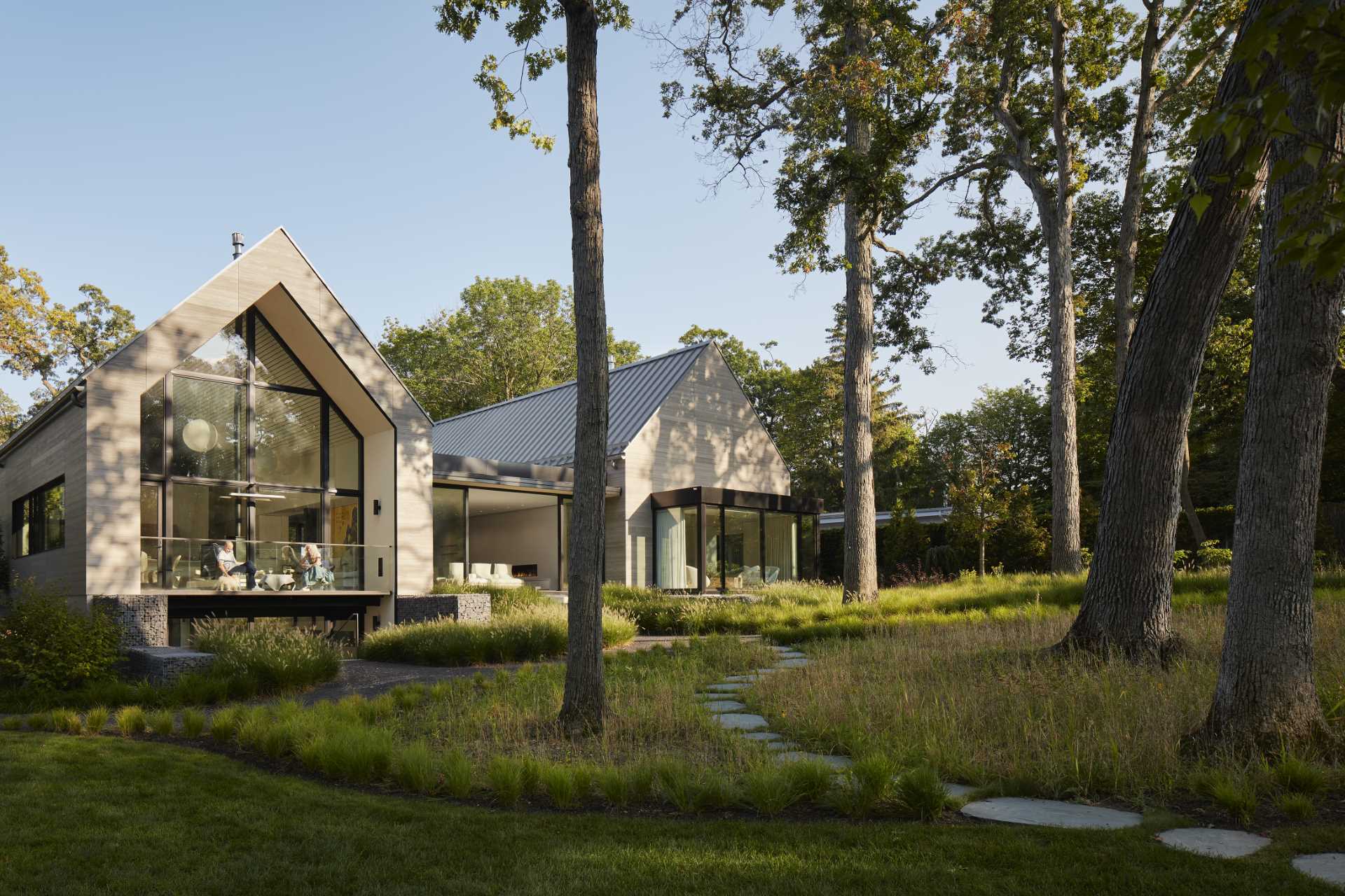 Pathways lead from the house through the rear garden and to an outdoor entertaining area.